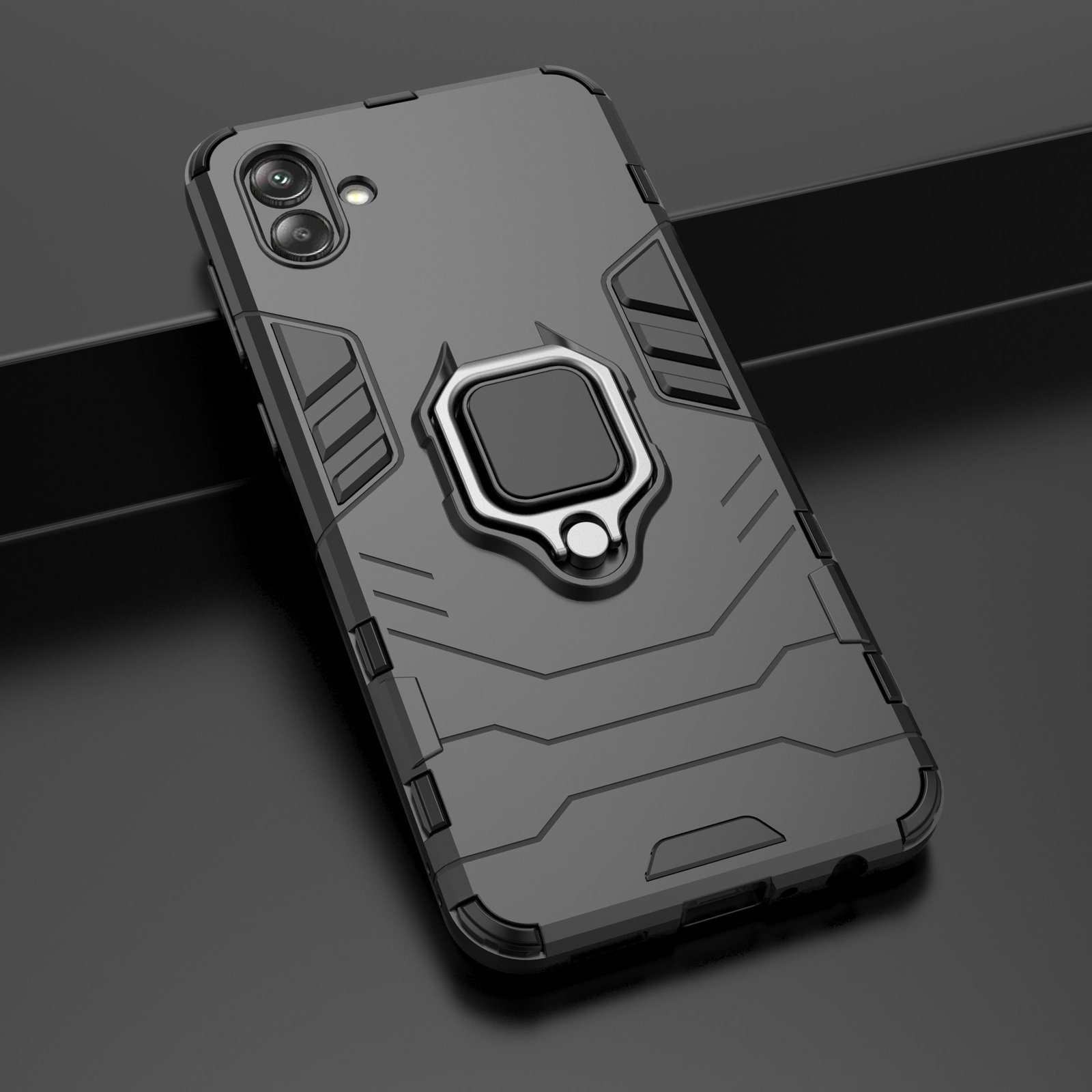 Funda negra para teléfono con soporte de anillo. El teléfono está sobre una superficie, mostrando la parte trasera de la funda.