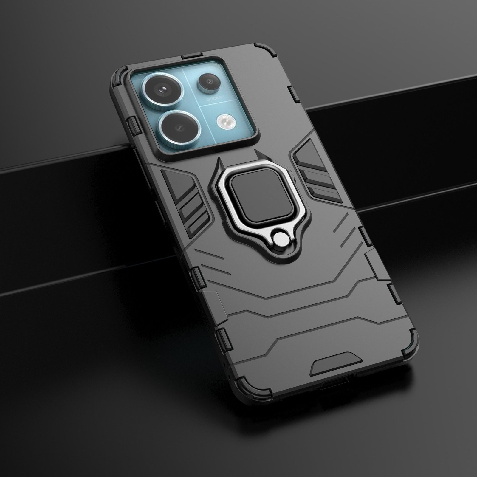 Funda oscura con soporte de anillo. La funda está en ángulo sobre una superficie oscura, con módulo de cámara.
