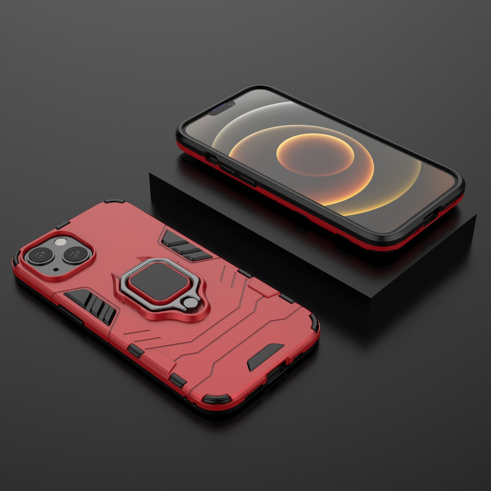 Dos teléfonos, uno en una funda roja, sobre una superficie negra. Un teléfono está en un soporte.