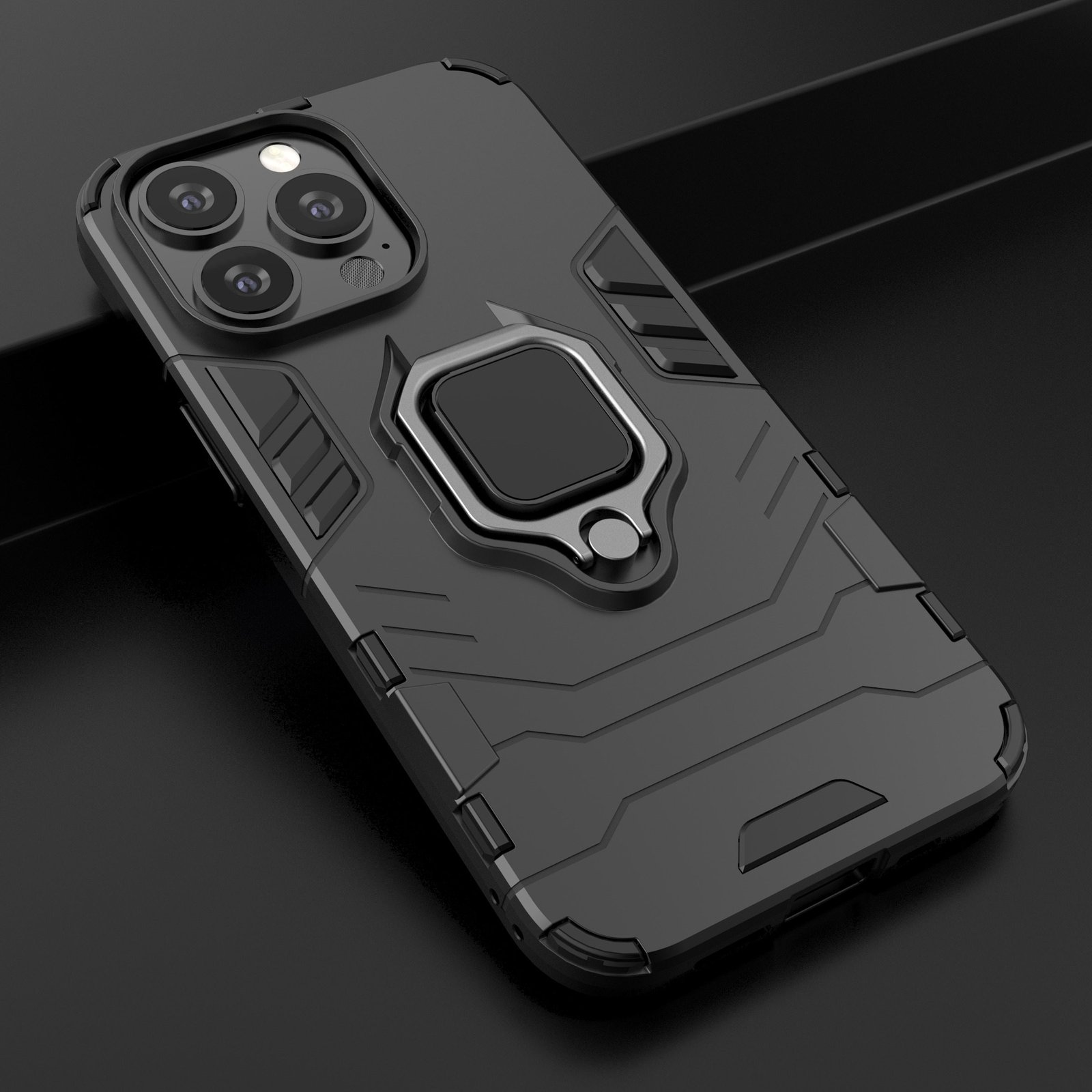 Funda de teléfono negra con soporte de anillo. La funda está sobre una superficie oscura.