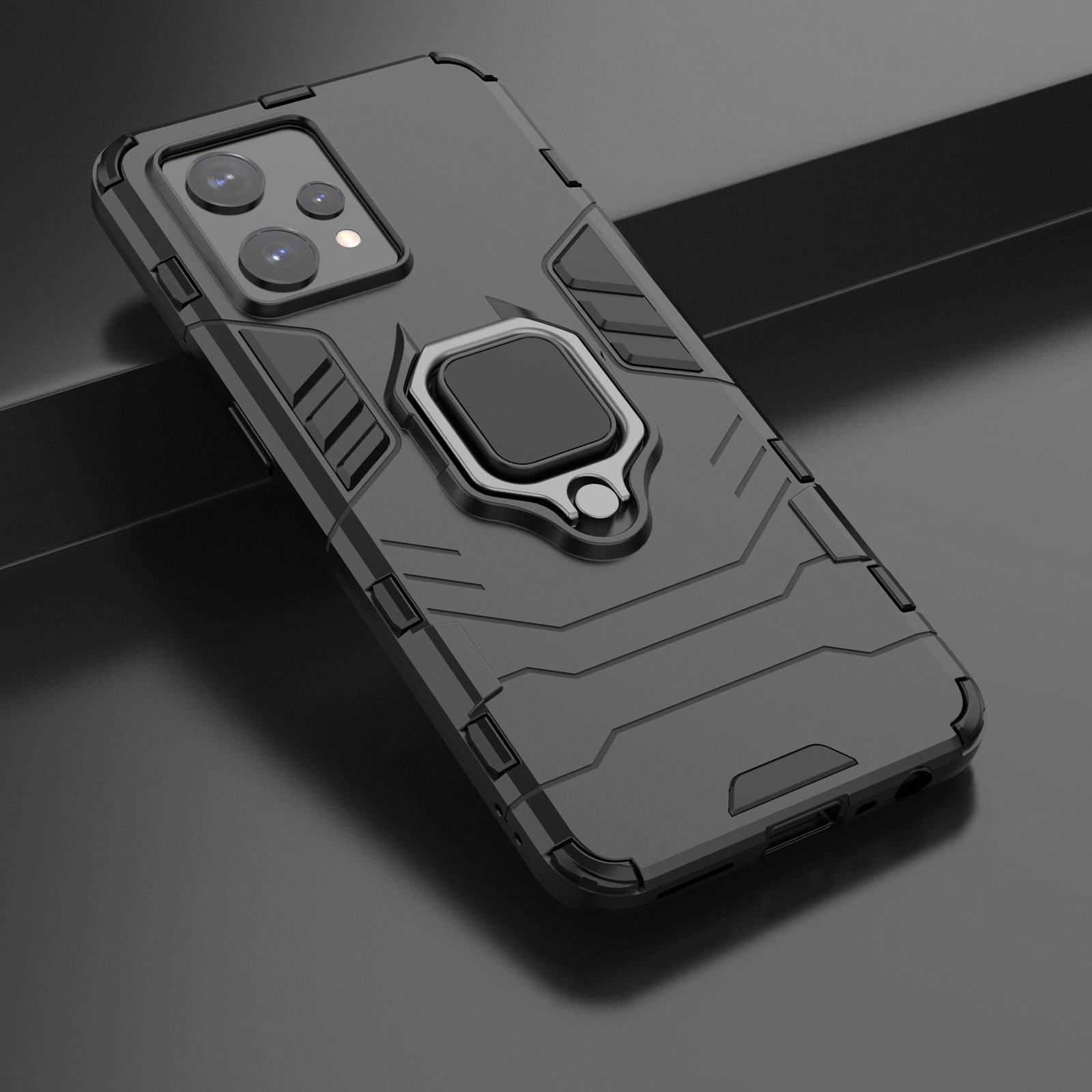 Funda negra para teléfono con soporte de anillo. Es una funda protectora, con detalles texturizados y diseño elegante.