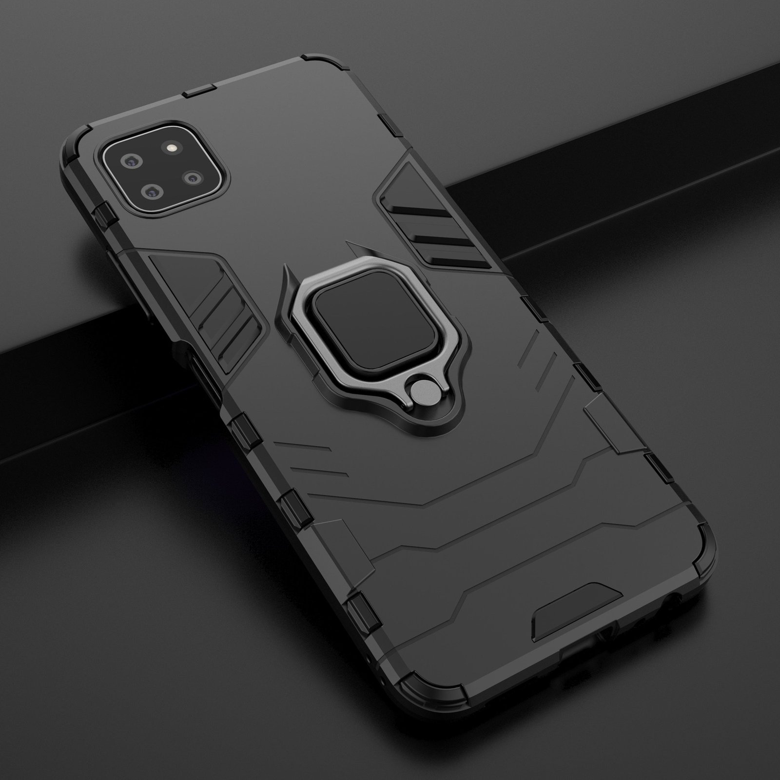 Teléfono negro en funda negra con soporte de anillo. El teléfono está en ángulo sobre superficie oscura.