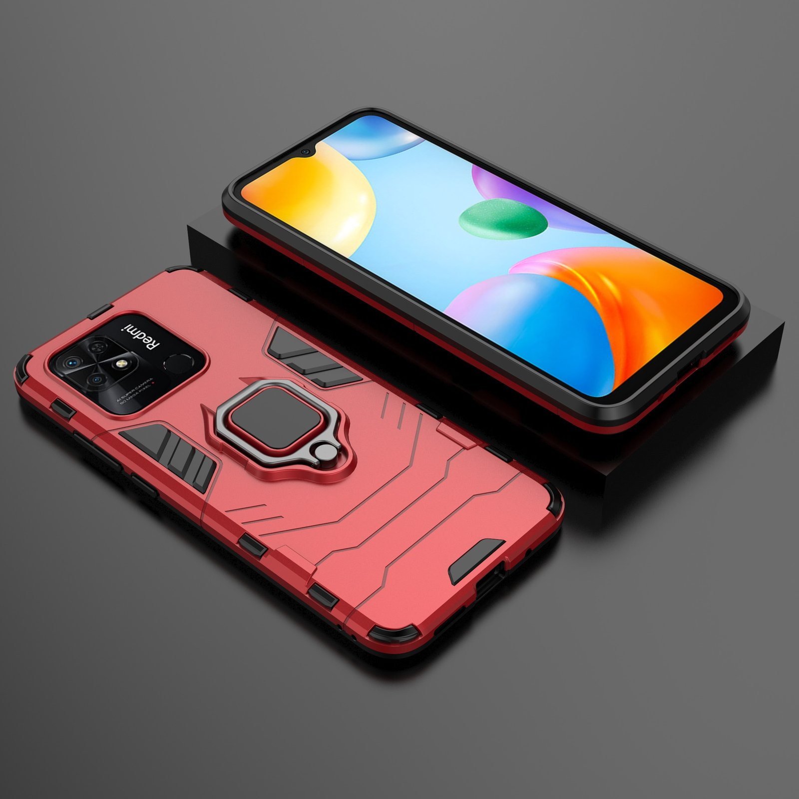 Funda roja para teléfono con soporte de anillo, teléfono sobre superficie negra, fondo oscuro.