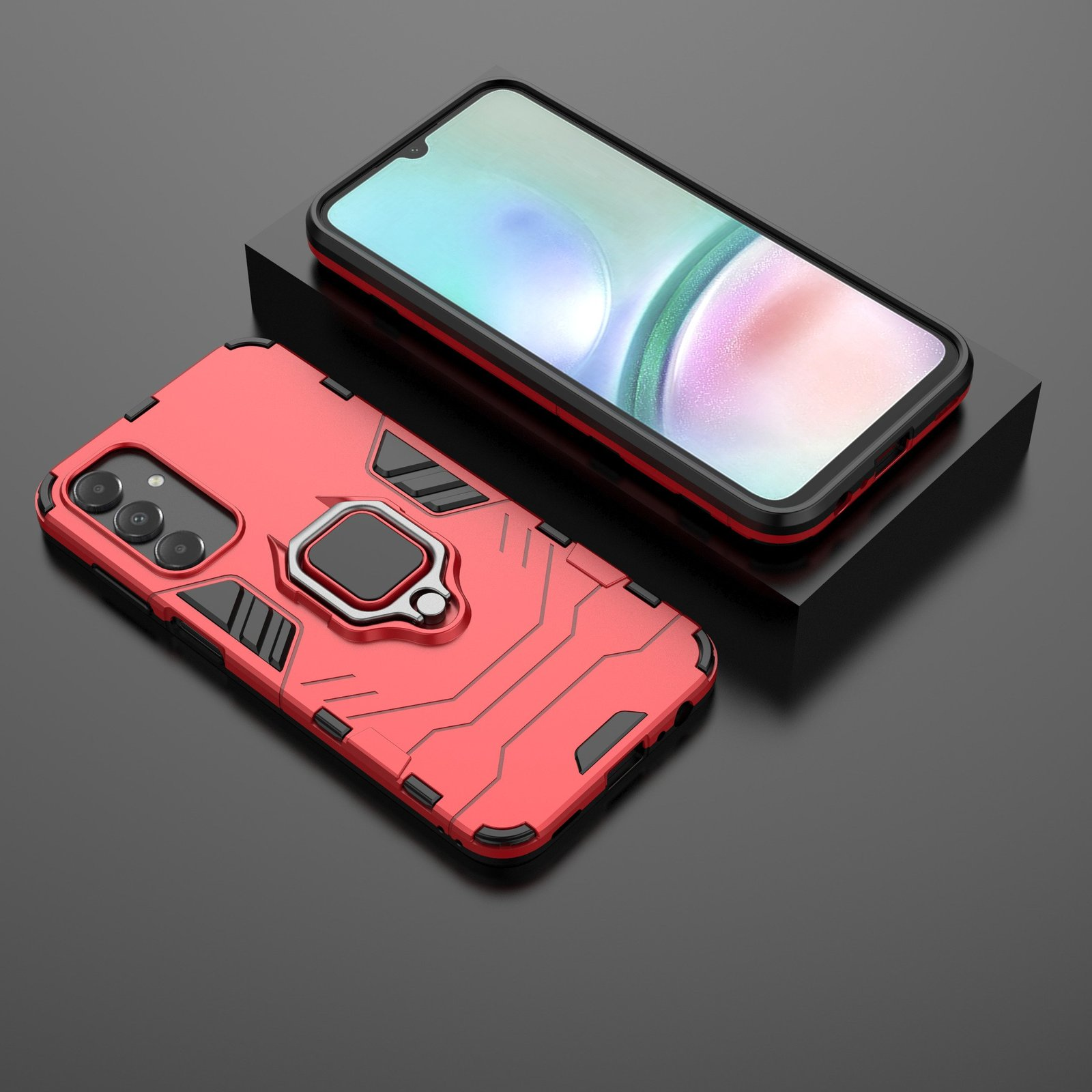 Funda roja y teléfono sobre superficie negra. Soporte de anillo visible. Detalles negros, inclinados.