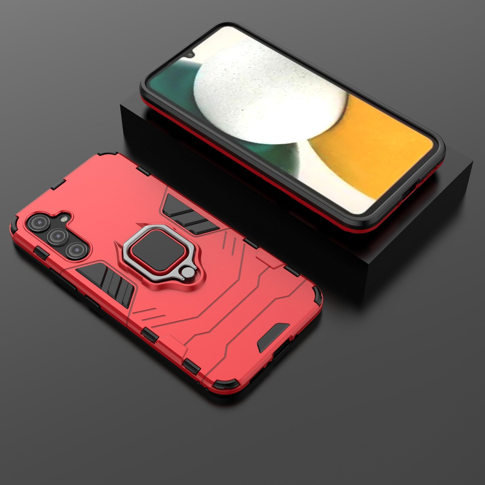Funda roja con soporte de anillo, protegiendo teléfono con pantalla colorida sobre superficie negra.