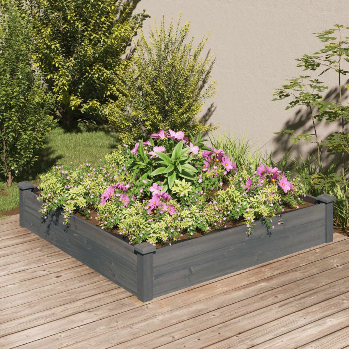 Erhöhtes Gartenbeet aus Holz mit Blumen und Pflanzen. Hintergrund: Holzterrasse.