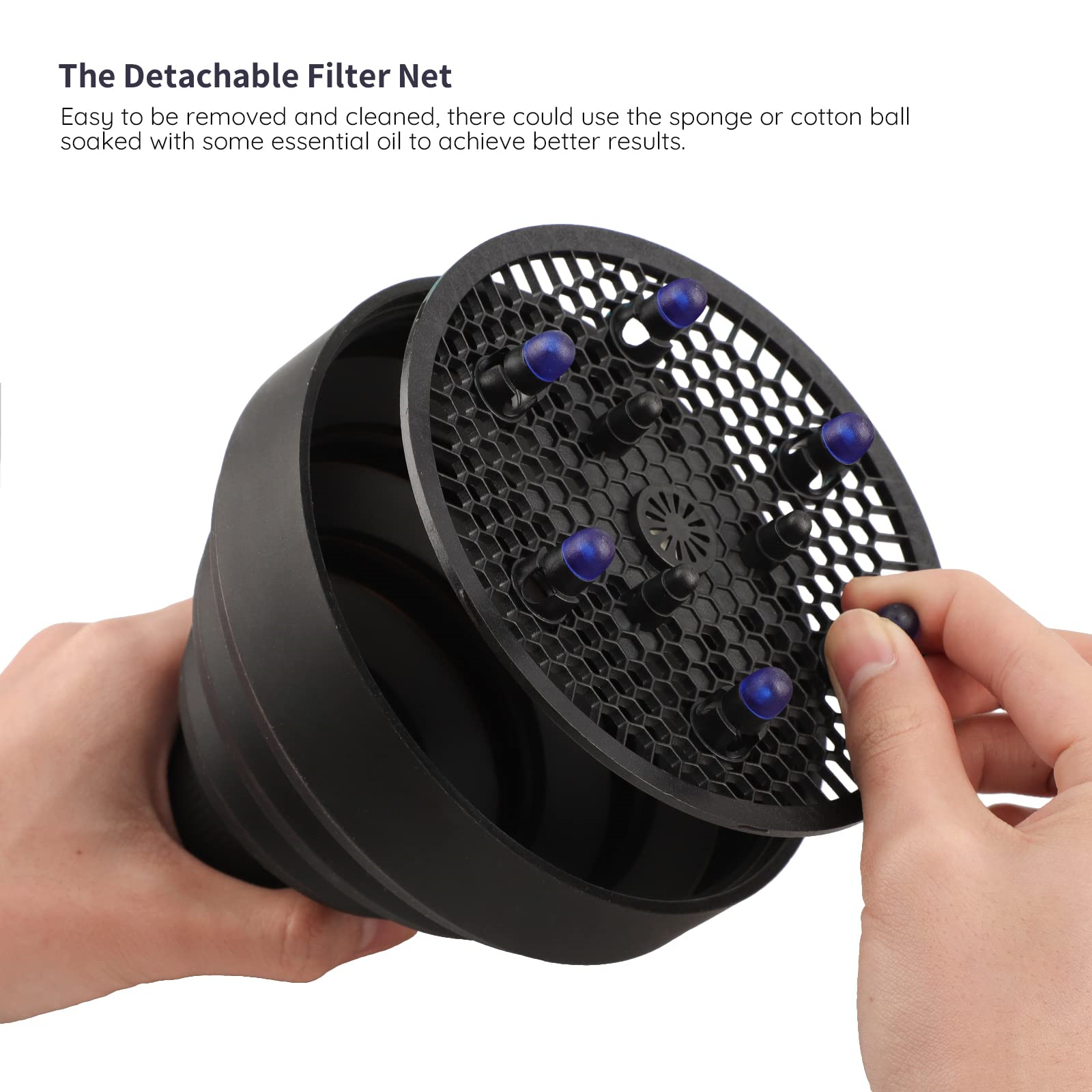 Ein schwarzer Haartrockner-Diffusor mit abnehmbarem Filternetz und blauen Stiften.