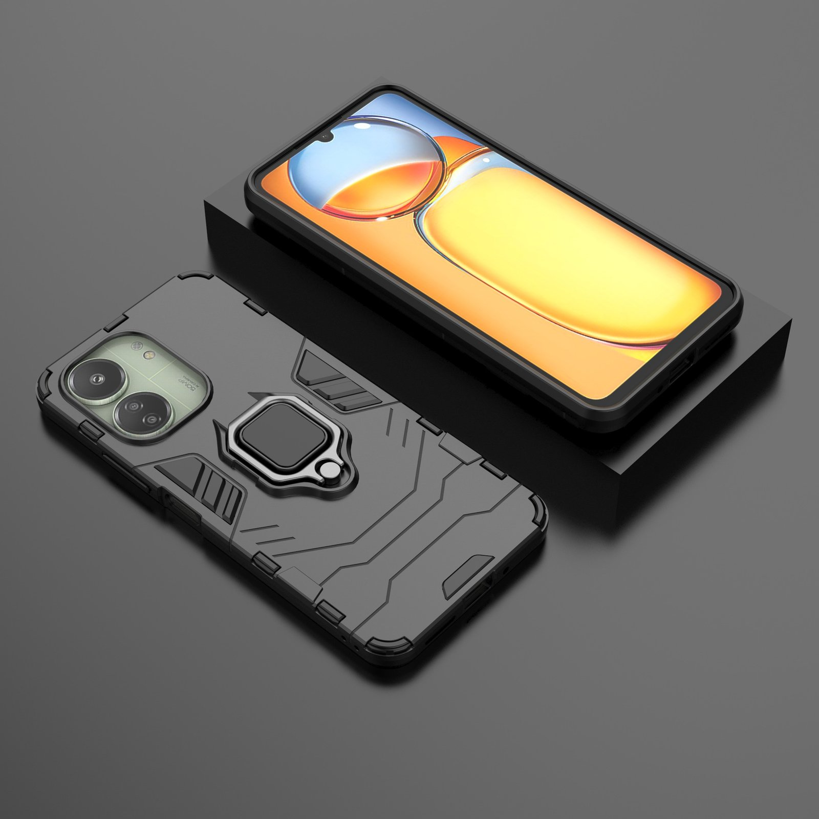 Funda de teléfono negra y gris con soporte de anillo y un teléfono sobre una superficie negra.