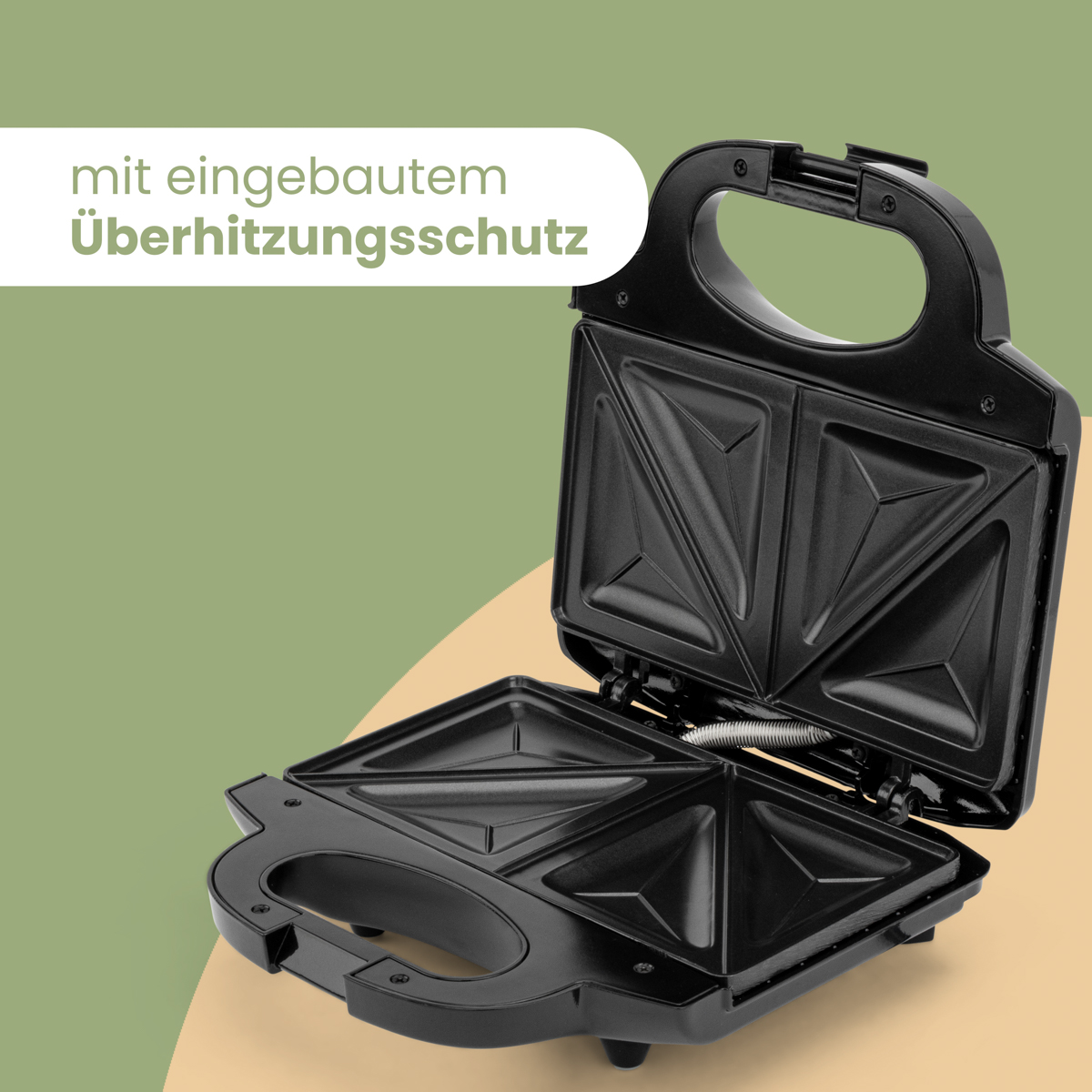 Czarny opiekacz do kanapek. Jest otwarty. Tekst brzmi 'mit eingebautem Überhitzungsschutz'.