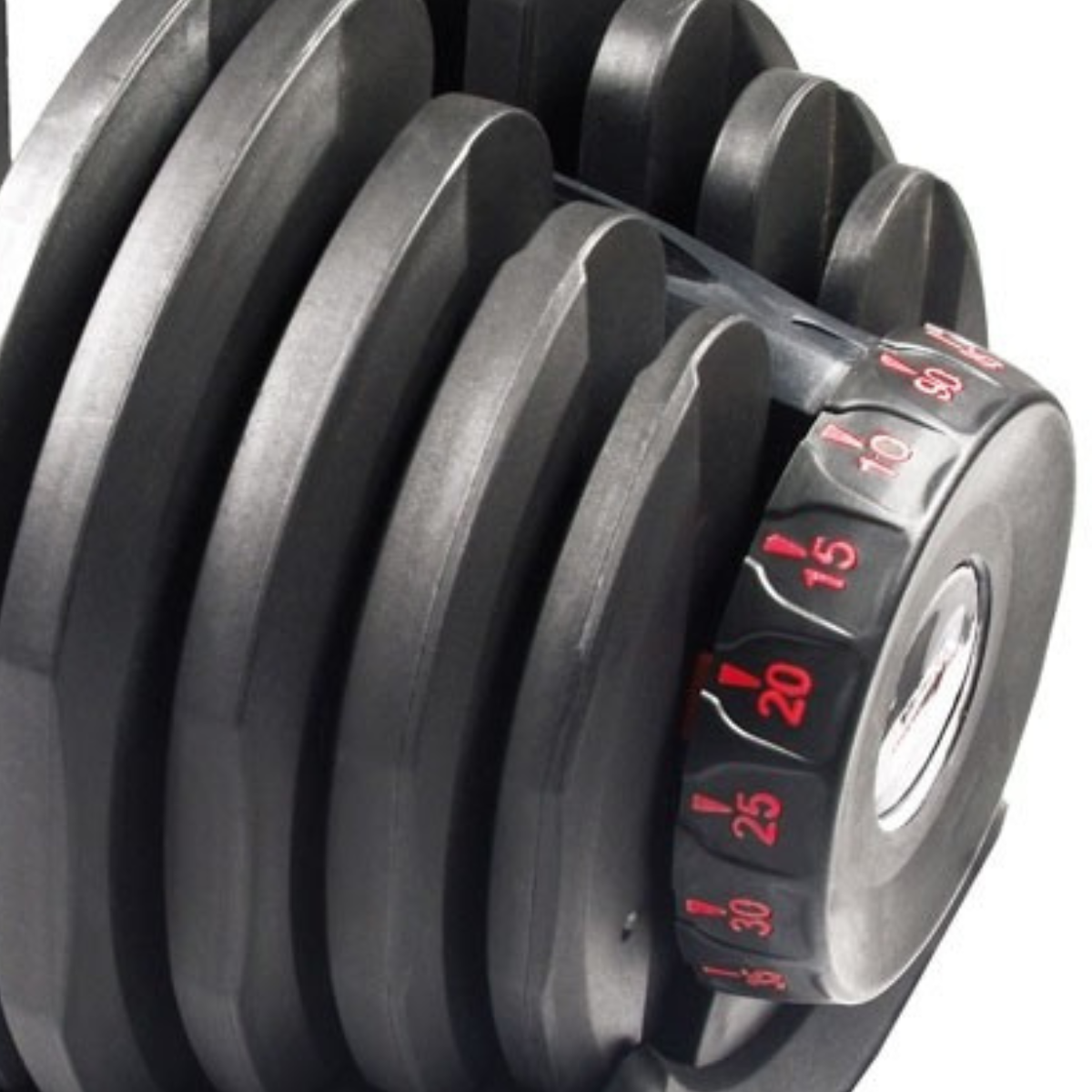 Close-up van de gewichtsknop van een verstelbare dumbbell. Cijfers en rode indicatoren zijn zichtbaar.