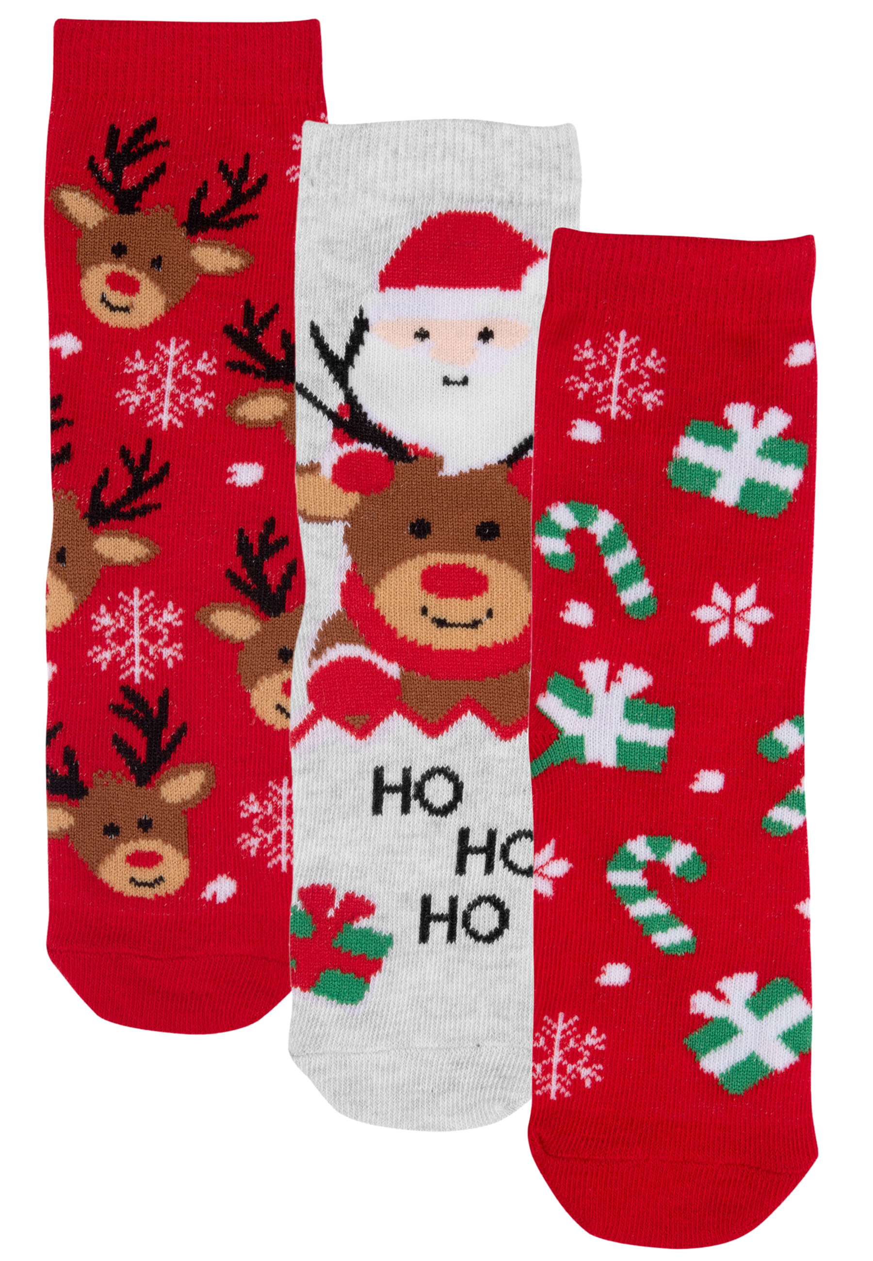 Drei Weihnachtssocken, rot mit Rentier- und Geschenk-Mustern, und eine weiße Socke mit Weihnachtsmann.