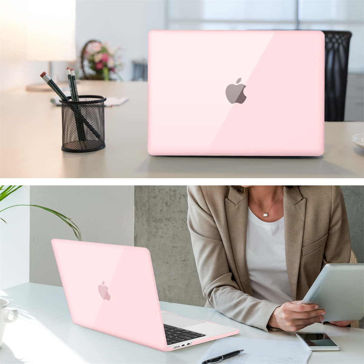 Zwei pinke Laptops auf einem Schreibtisch, einer geöffnet, einer geschlossen. Büro mit Stiften, Blumen.