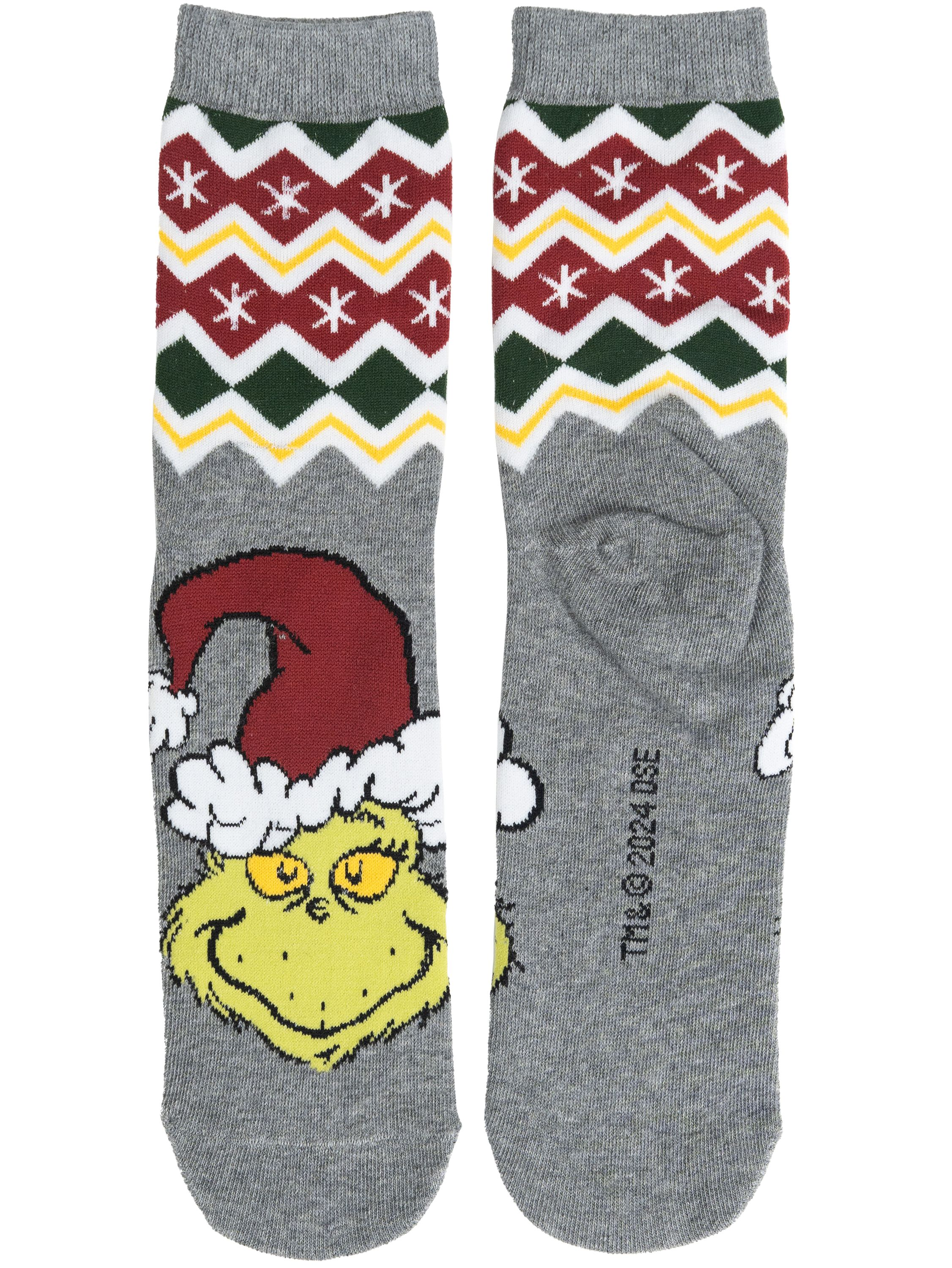 Ein Paar graue Socken mit einem Grinch-Cartoon und einem Weihnachtsmuster.