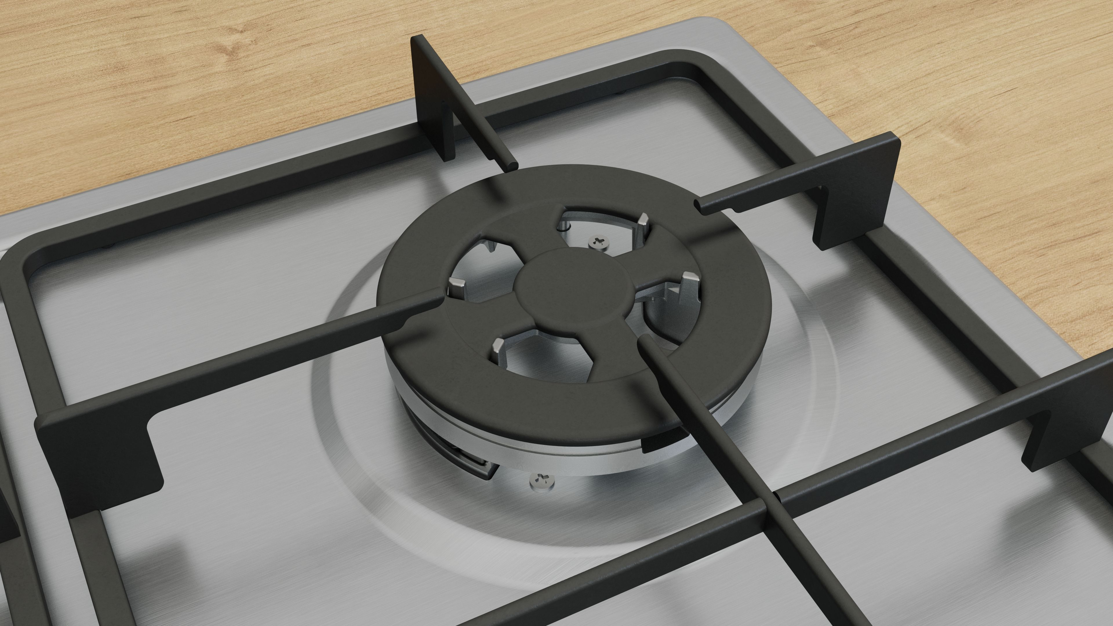 Zbliżenie palnika kuchenki gazowej, pokazujące głowicę palnika i otaczającą powierzchnię.