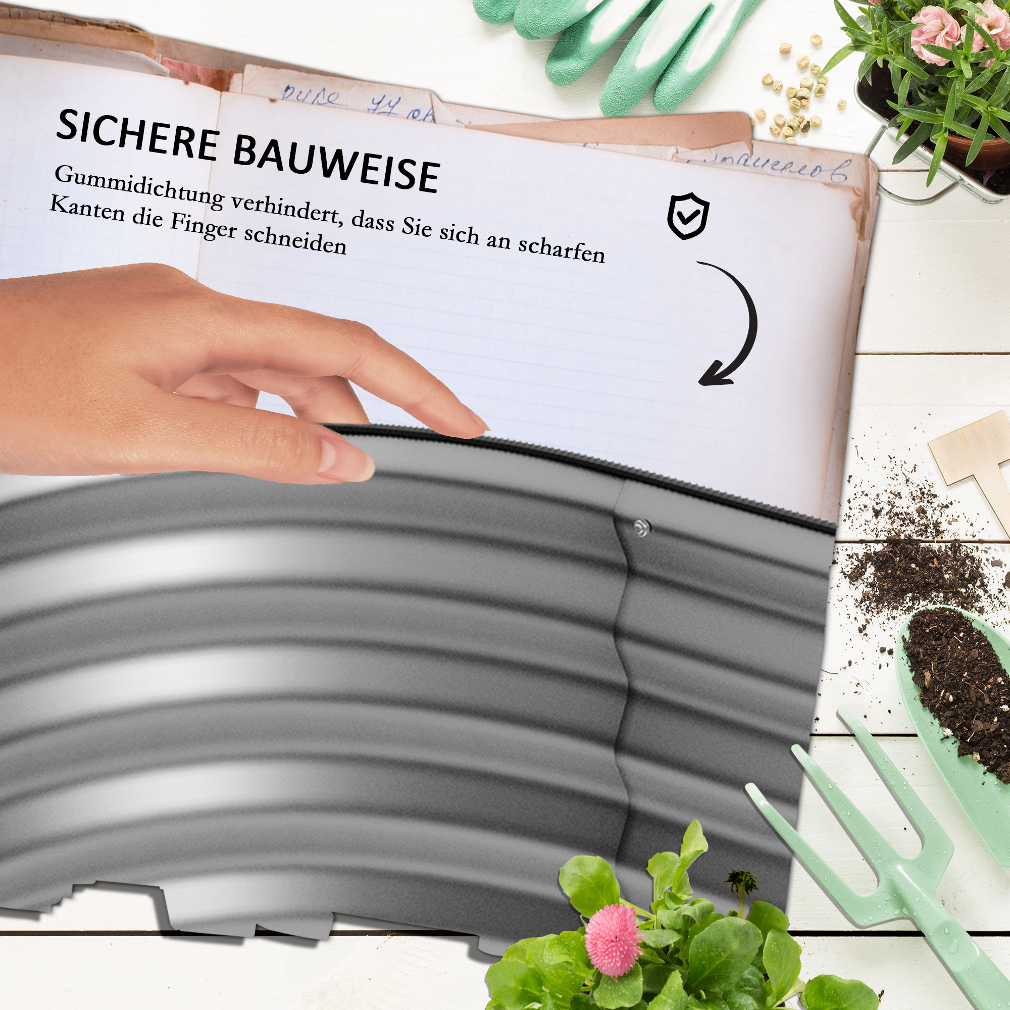 Offenes Buch mit Text über sicheres Bauen. Eine Hand zeigt auf die Seite. Hintergrund mit Gartengeräten.