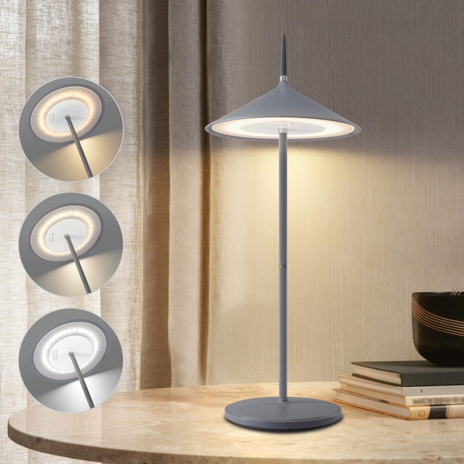 Szara lampa na stole z trzema ustawieniami światła. Biała ściana w tle.