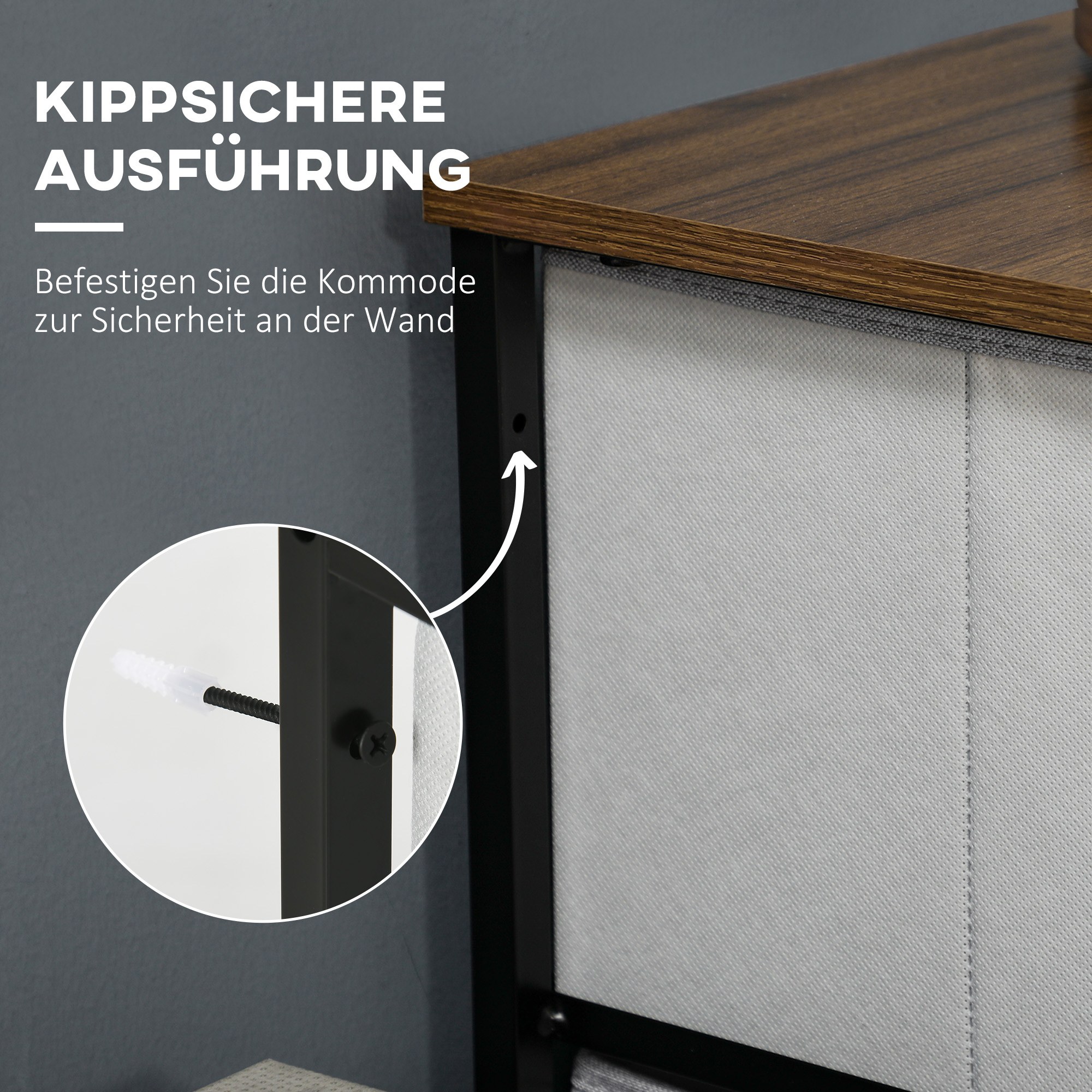 Nahaufnahme einer Kommode mit Schraube. Die Kommode hat graue Schubladen und eine dunkelbraune Oberseite mit schwarzem Rahmen.