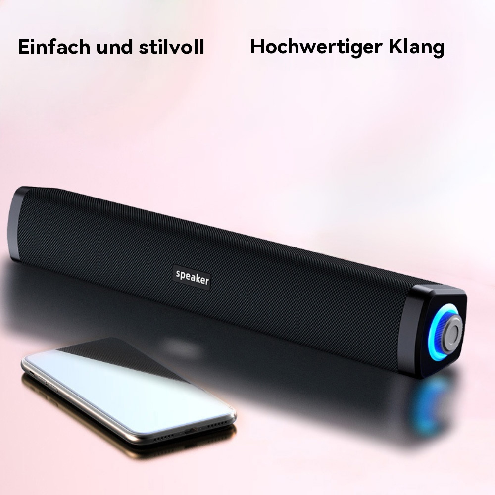 Ein schwarzer Soundbar-Lautsprecher neben einem Smartphone. Der Lautsprecher hat ein schlichtes Design.