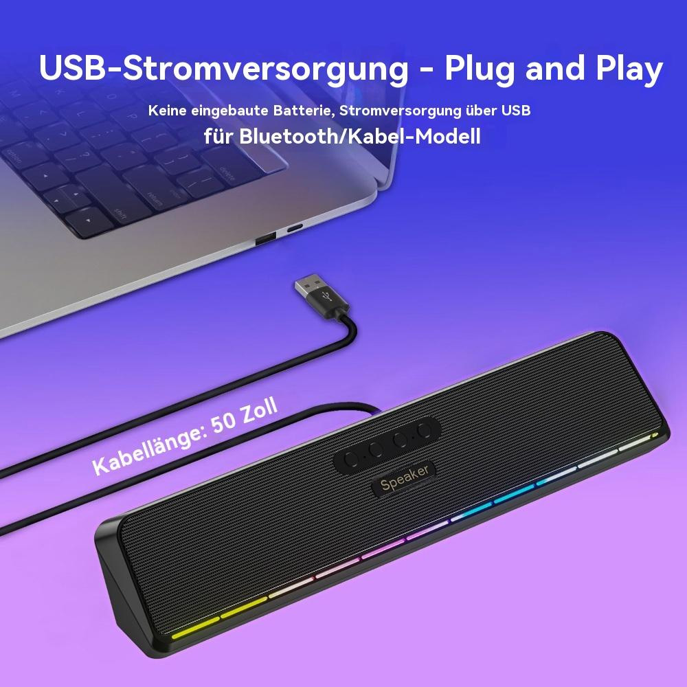 Ein schwarzer Lautsprecher mit farbigen Lichtern, über ein USB-Kabel mit einem Laptop verbunden.