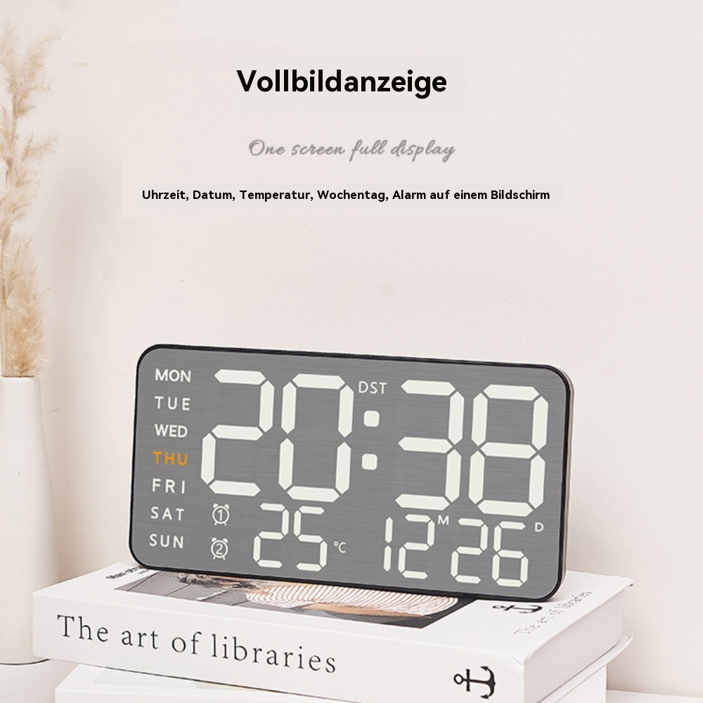 Digitaluhr mit Anzeige von Zeit, Datum, Temperatur und Wochentag. Text auf Deutsch.