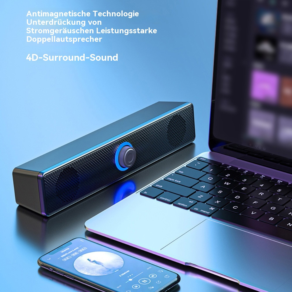 Eine Soundbar liegt auf einem Laptop. Die Soundbar ist schwarz mit blauem Licht um den Drehknopf.