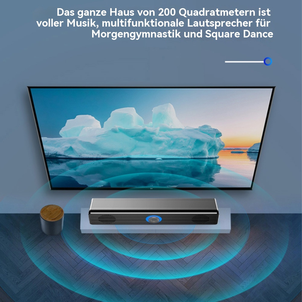Ein Lautsprecher auf einer weißen Oberfläche vor einem großen Fernsehbildschirm. Der Bildschirm zeigt eine Eisbergszene.