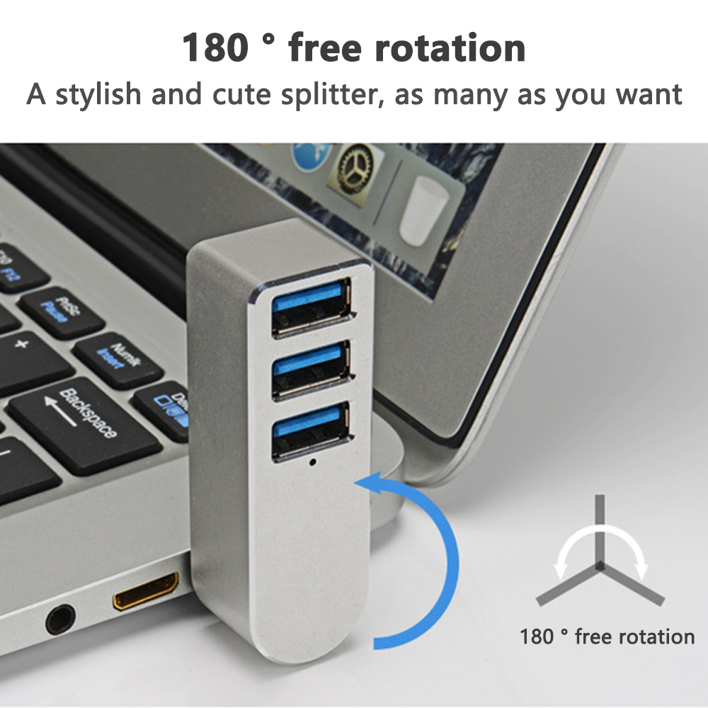 Silberner USB-Hub, der mit einem Laptop verbunden ist, mit einem blauen Pfeil, der die Drehung anzeigt.