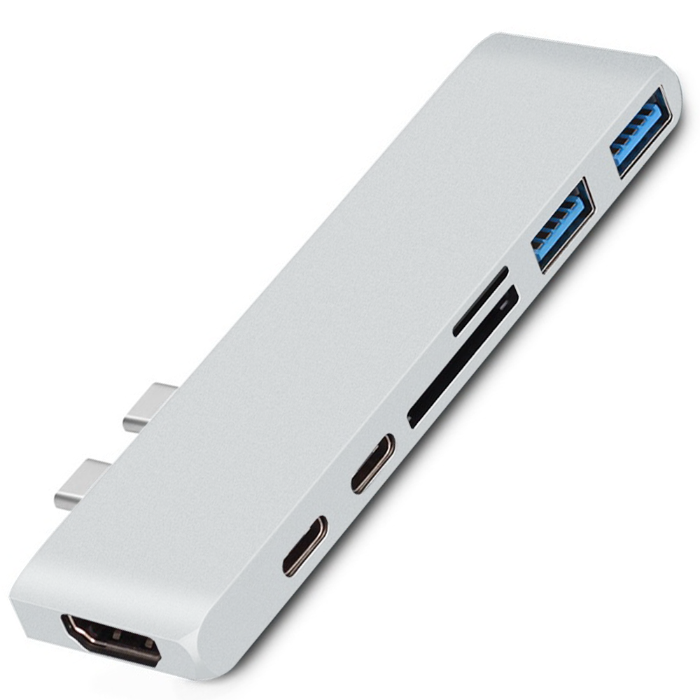 Ein silberner USB-Hub mit mehreren Anschlüssen: HDMI, USB und SD-Kartensteckplätze.