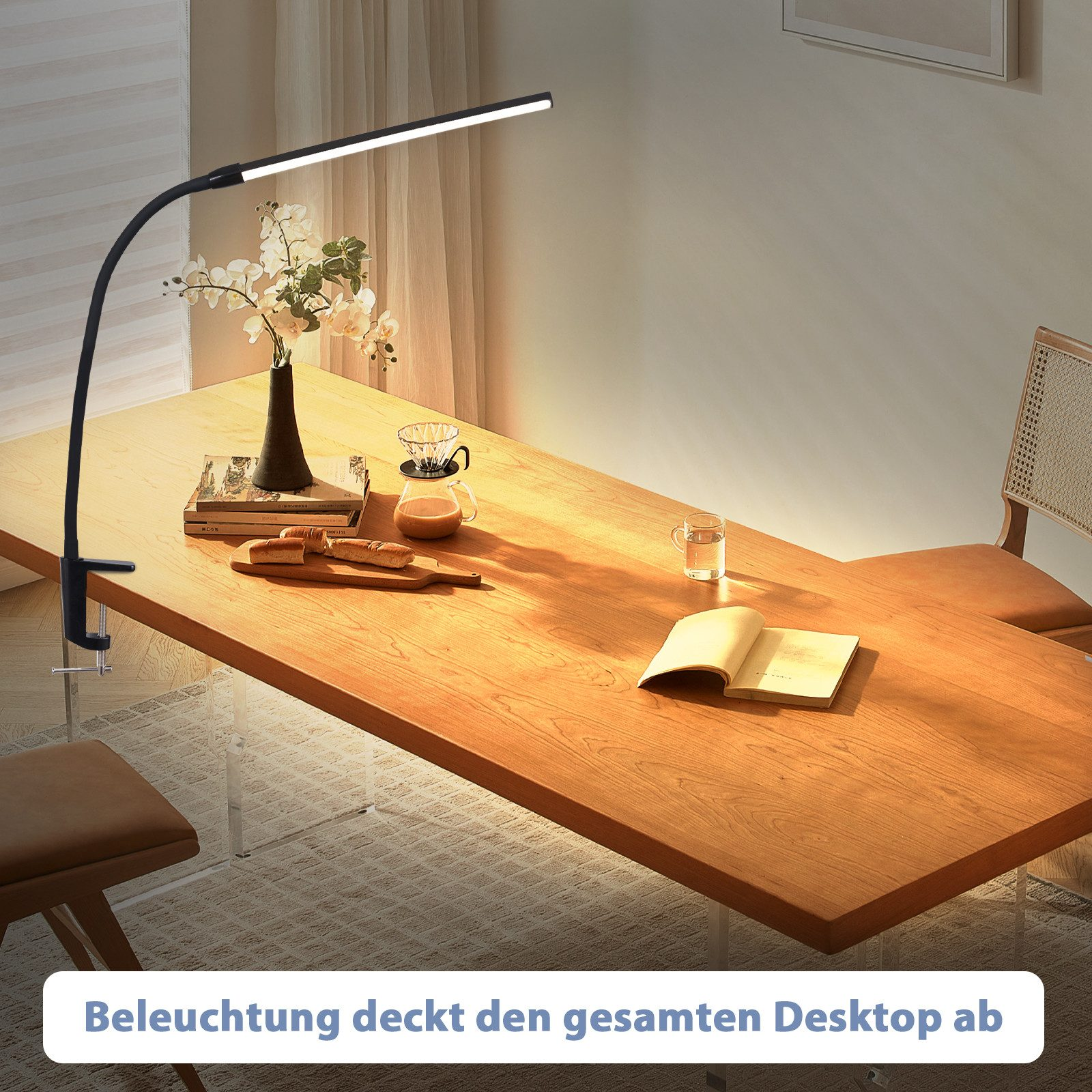 Czarna lampa biurkowa nad stołem. Lampa jest ustawiona pod kątem nad stołem.