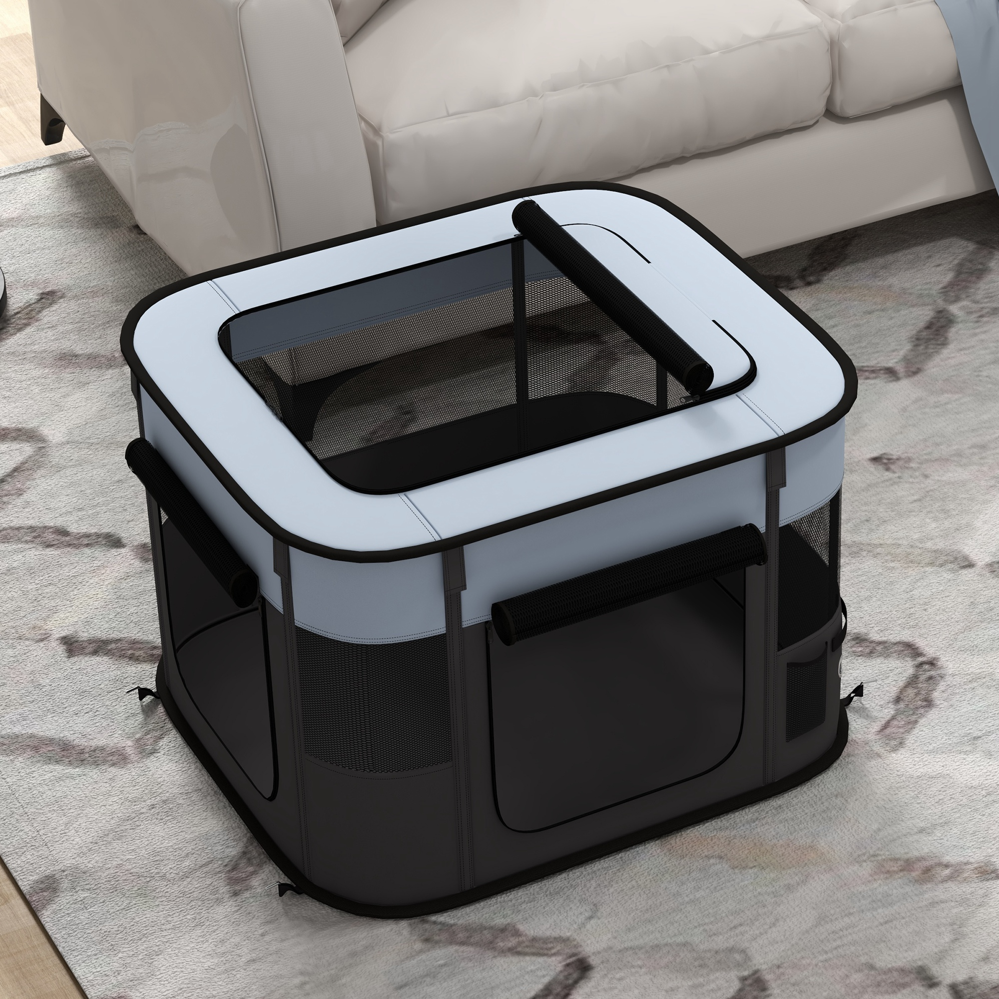 Faltbares Haustiergehege auf einem Teppich. Schwarz und grau mit Netzeinsätzen.