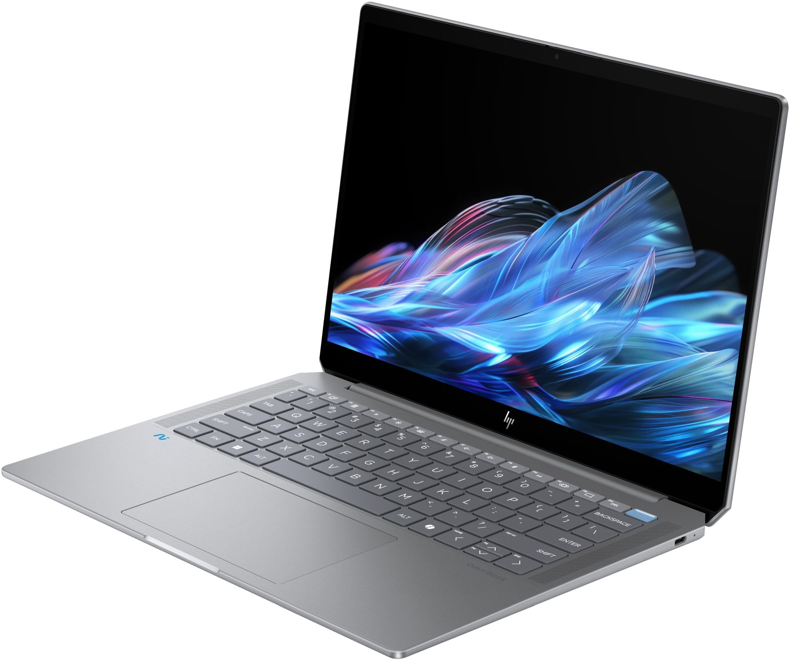 Srebrny laptop jest otwarty, wyświetlając niebieski i fioletowy abstrakcyjny wzór na ekranie.