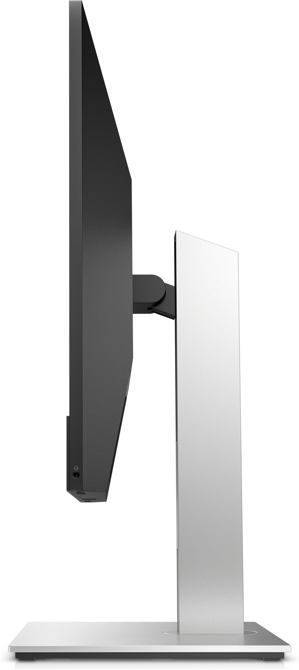 Widok z boku monitora komputera, czarny ekran, srebrna ramka i srebrny stojak. Białe tło.