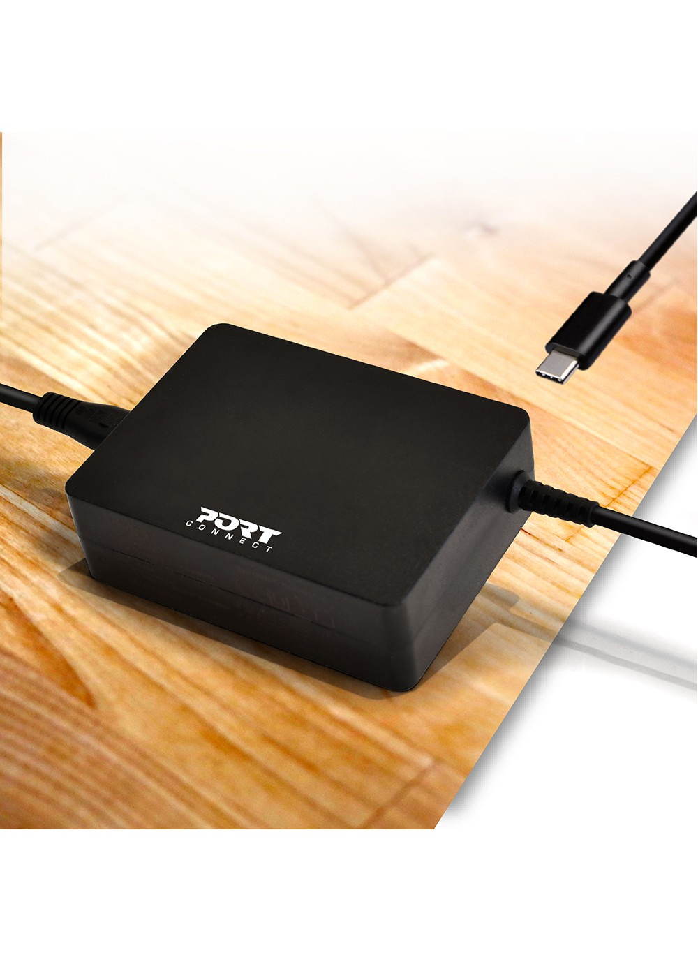 Czarny zasilacz z kablem USB-C podłączonym do laptopa. Tekst: 'For USB-C 90W'.