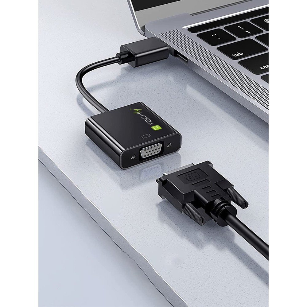 Adaptador negro con puerto VGA y puerto USB-C conectado a un portátil.