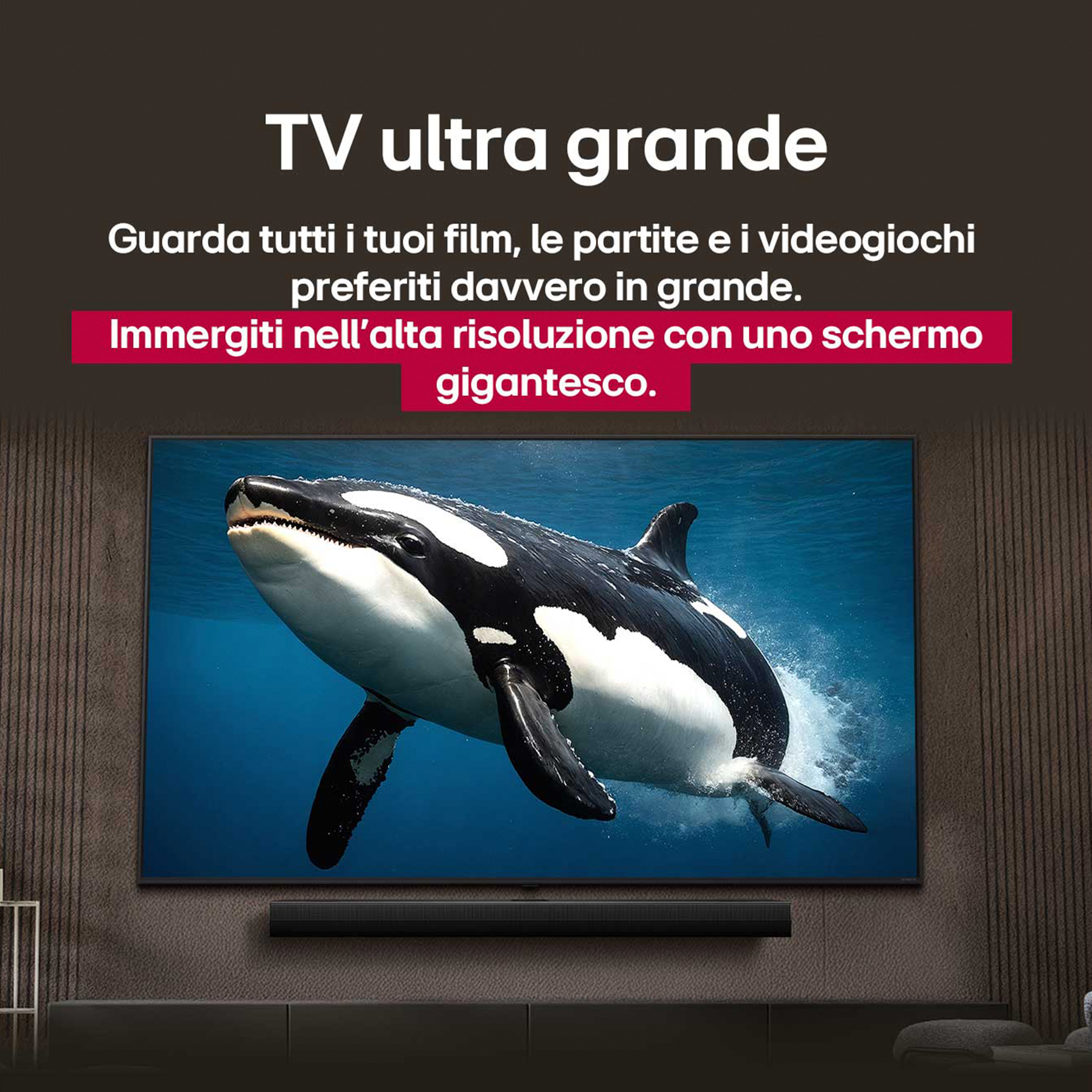 Une grande télévision affichant une image de baleine sous-marine, devant un mur et une barre de son.