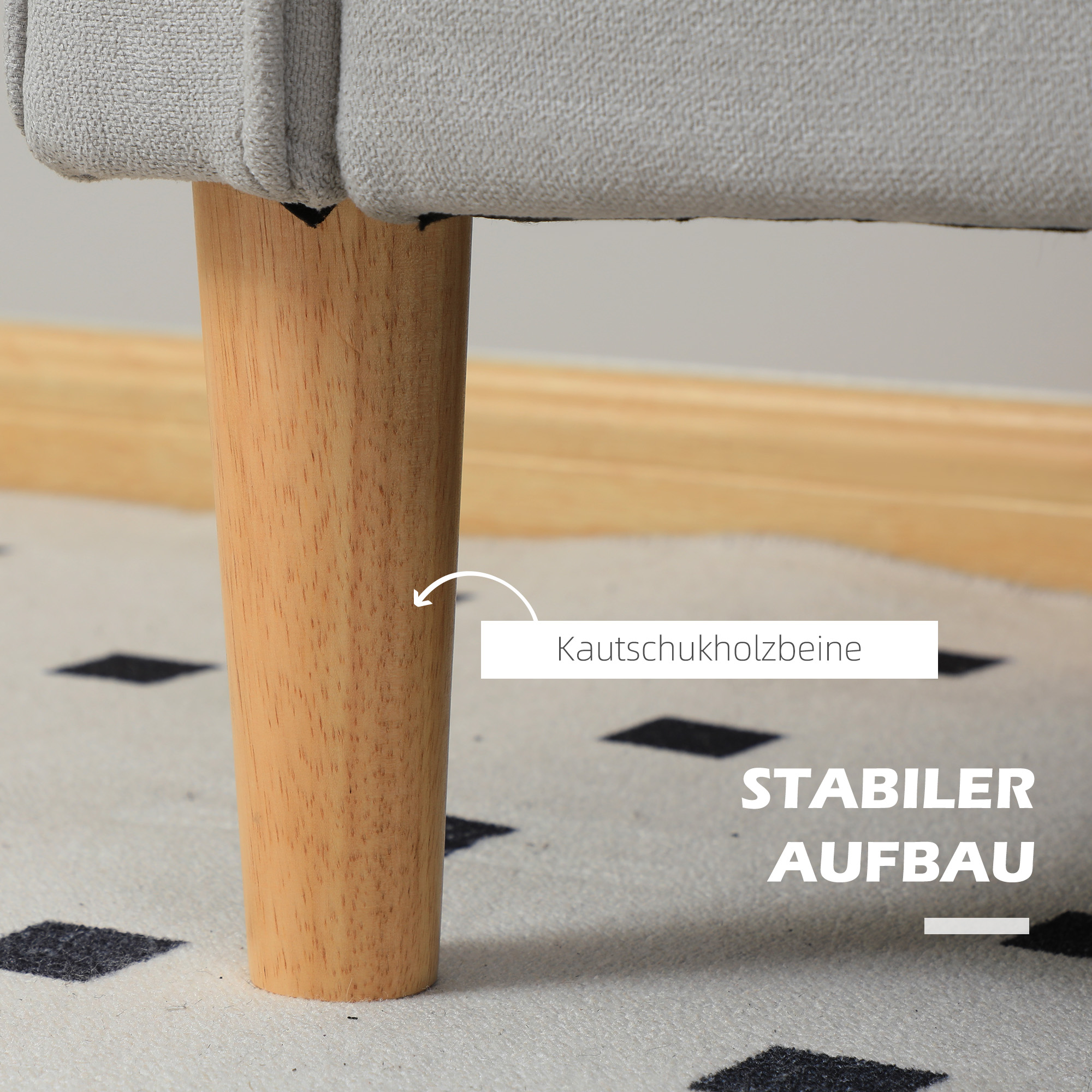 Nahaufnahme des Holzbeins einer Liebescouch. Text zeigt 'Kautschukholzbeine' und 'stabiler Aufbau'.
