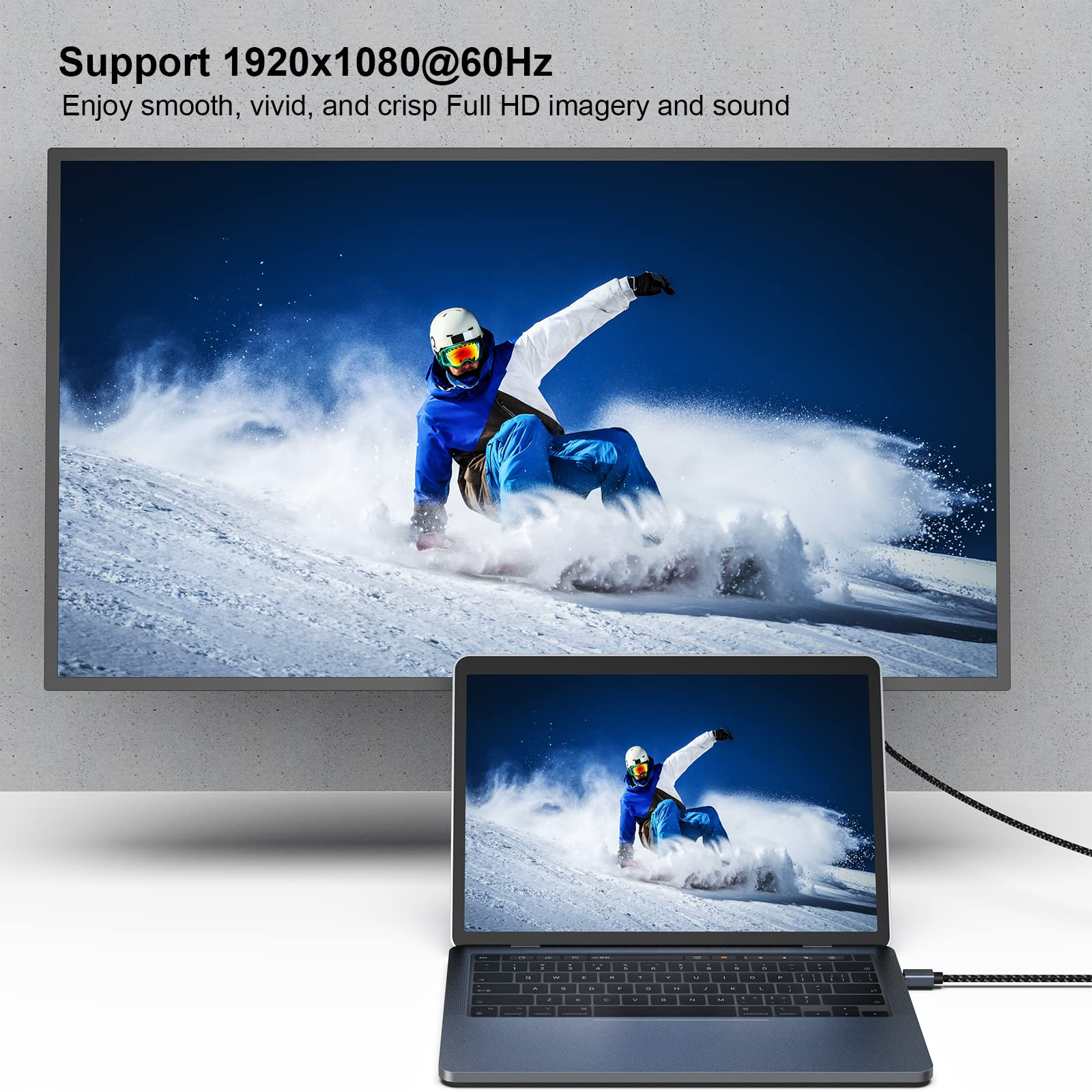Ein Laptop, der einen Snowboarder auf einem Fernsehbildschirm zeigt. Der Laptop ist mit dem Fernseher verbunden.