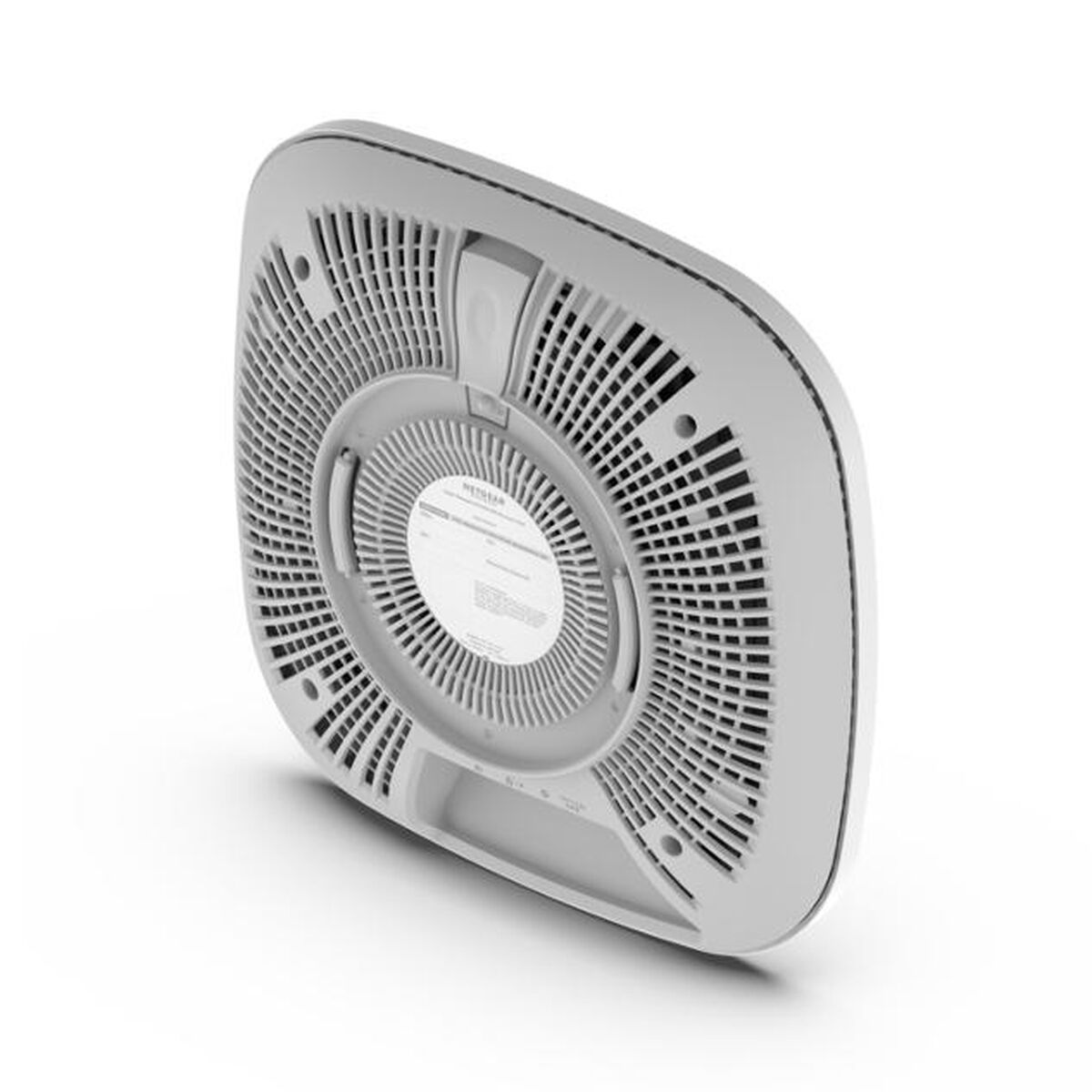 Białe urządzenie sieciowe, widok od dołu. Posiada otwory wentylacyjne i okrągły kształt.