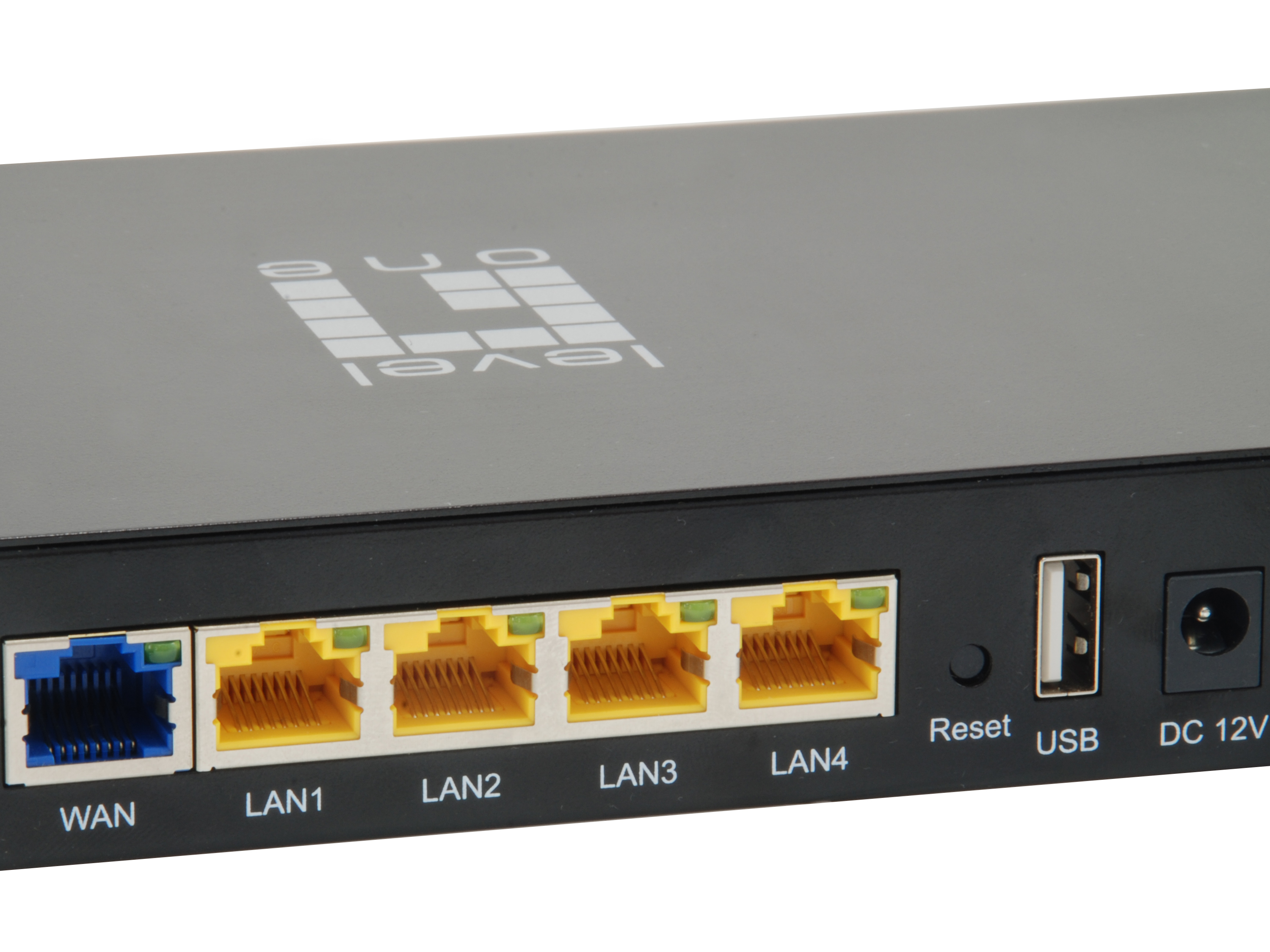 Close up of a black router with WAN, LAN, USB and power ports.