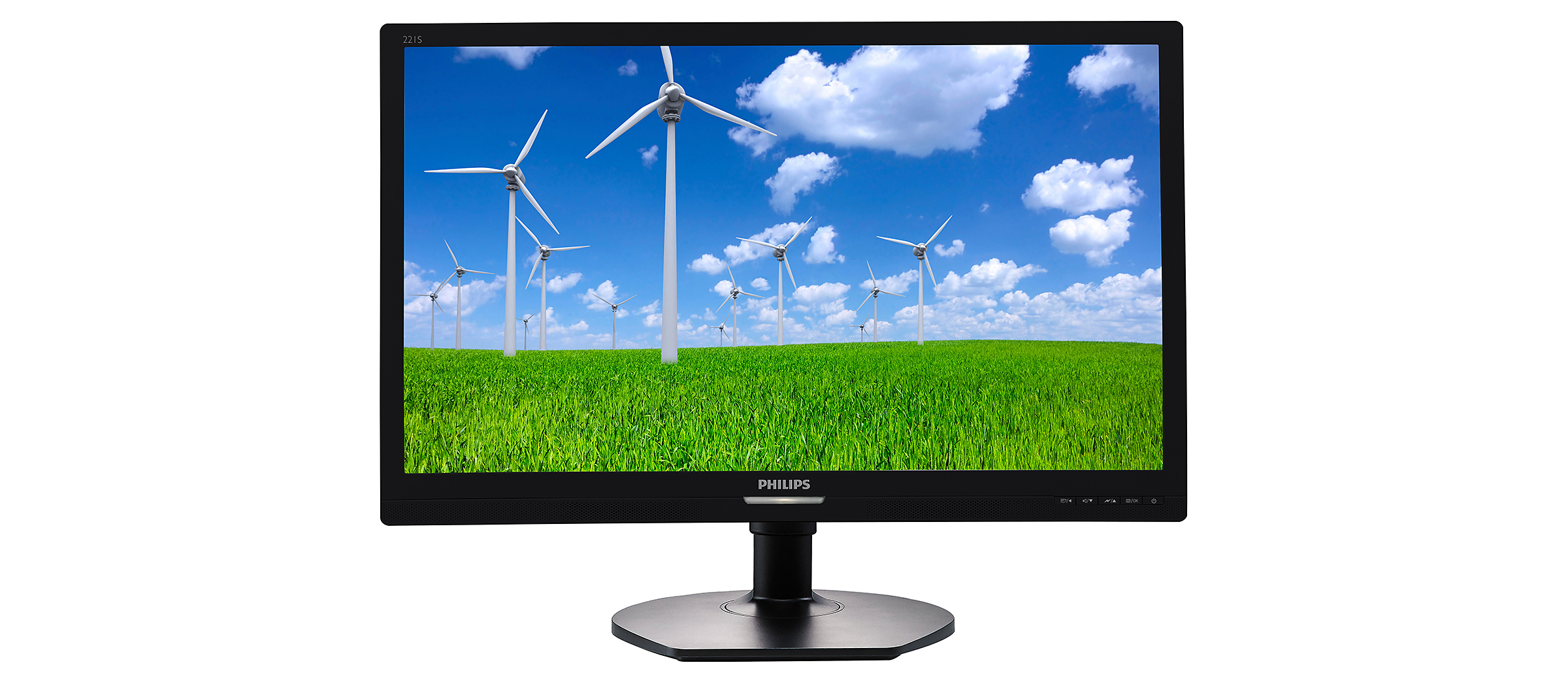 Un monitor mostra turbine eoliche su un campo verde sotto un cielo blu.