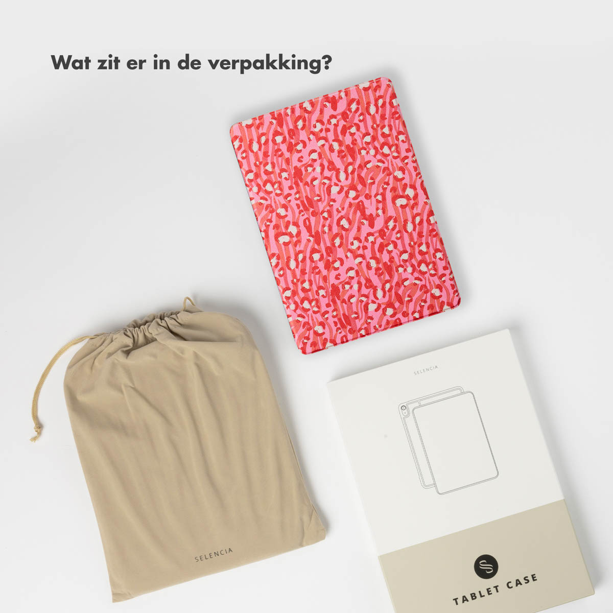 Étui de tablette, pochette et boîte. L'étui a un motif rose et rouge. Texte : Qu'y a-t-il dans le paquet ?