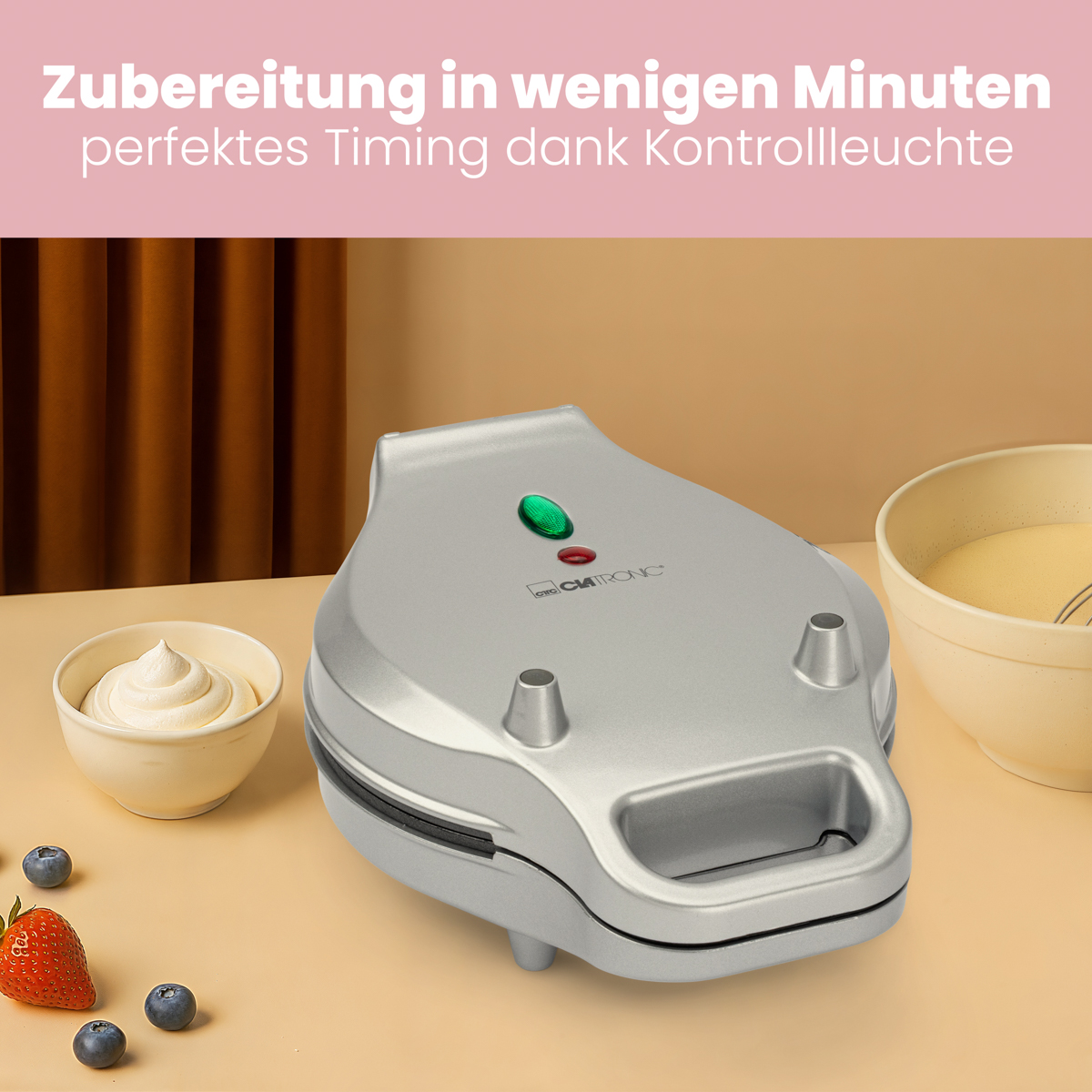 Gofrownica ze składnikami. Tekst w języku niemieckim. Różowe i białe tło.