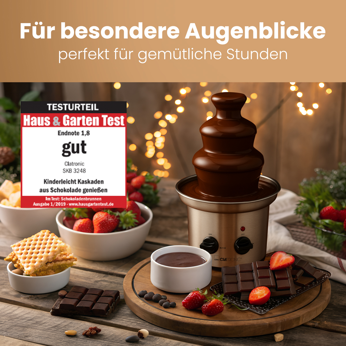 Fontanna czekoladowa z czekoladą, truskawkami i goframi na stole.