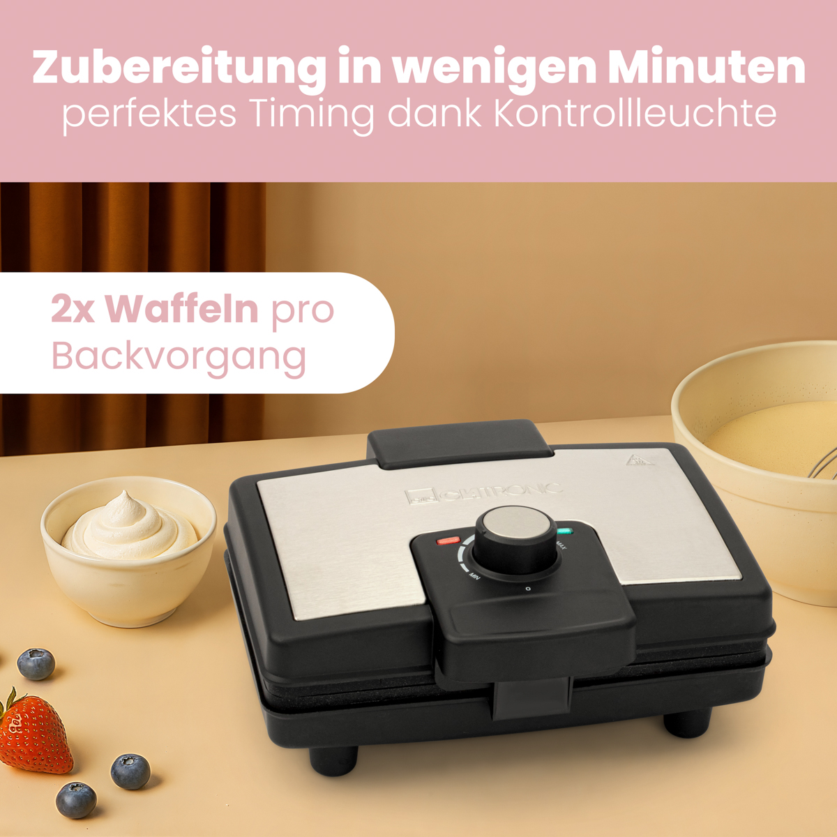 Gofrownica z goframi, bitą śmietaną i jagodami. Tekst w języku niemieckim u góry.