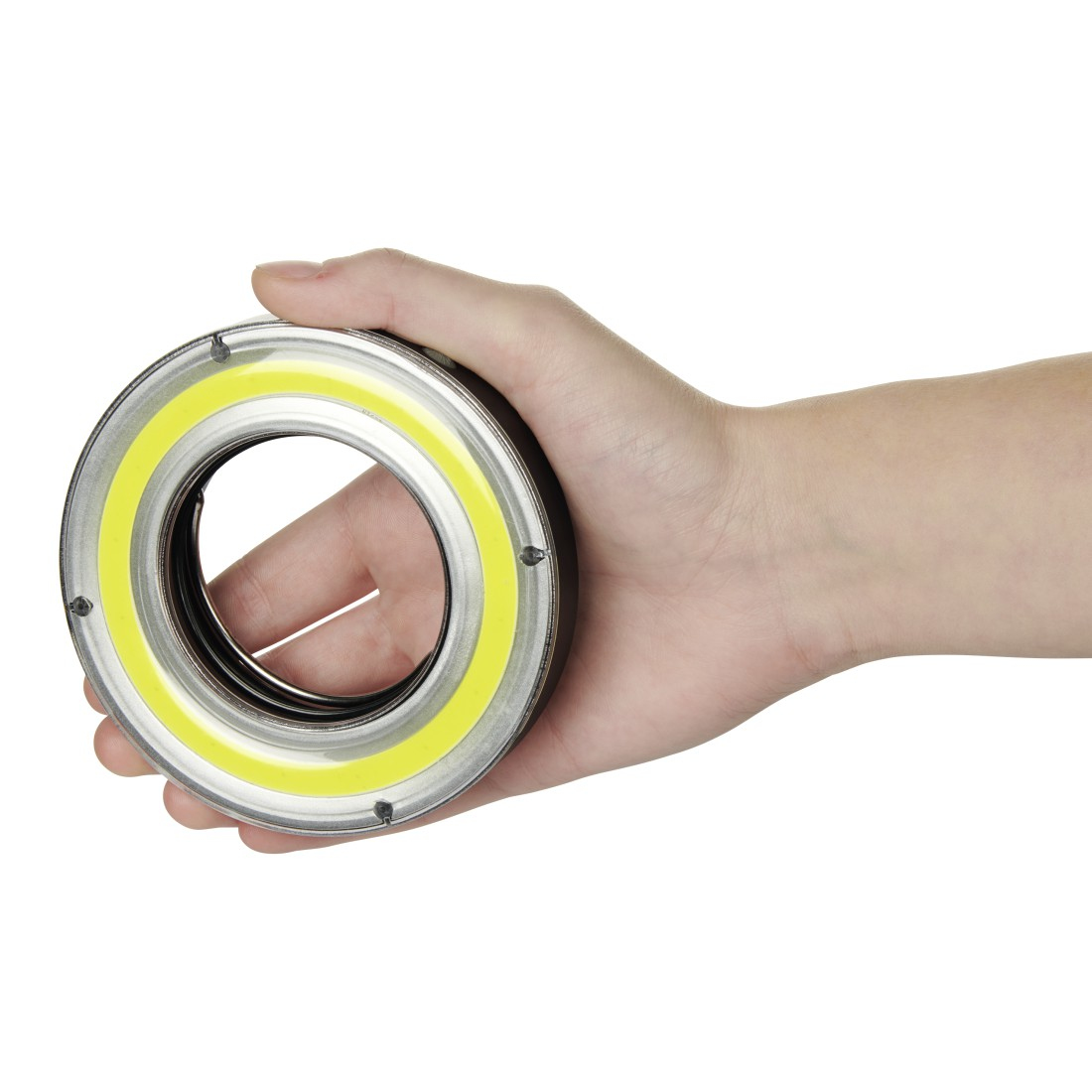 Main tenant une lampe annulaire, une lumière circulaire avec un centre jaune.