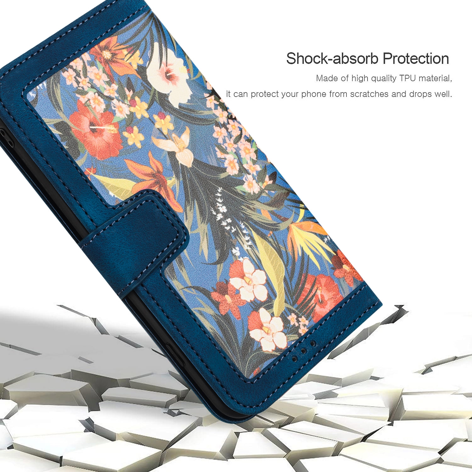 Funda de teléfono azul con estampado floral. Estuche abierto, en ángulo y sobre superficie agrietada.