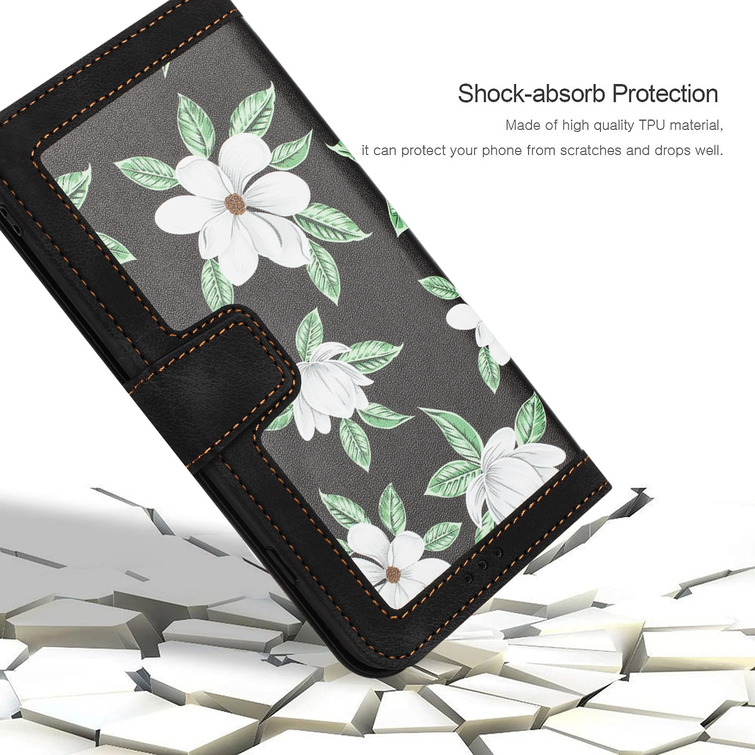 Funda negra para teléfono con diseño floral blanco, abierta para revelar el teléfono, con una superficie agrietada debajo.