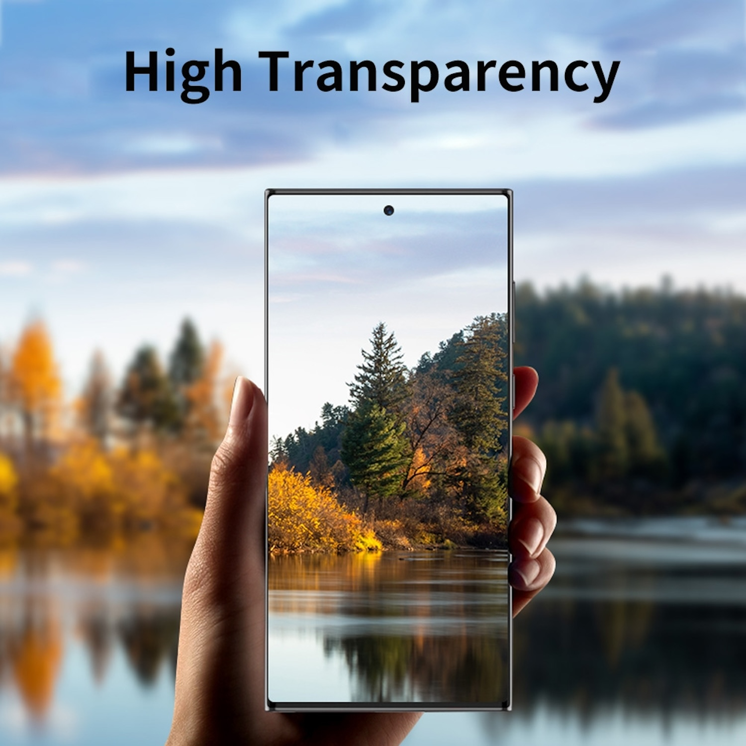 Hand, die ein Telefon hält, dessen Bildschirm eine Landschaft zeigt. Bäume, See, blauer Himmel. Hohe Transparenz.