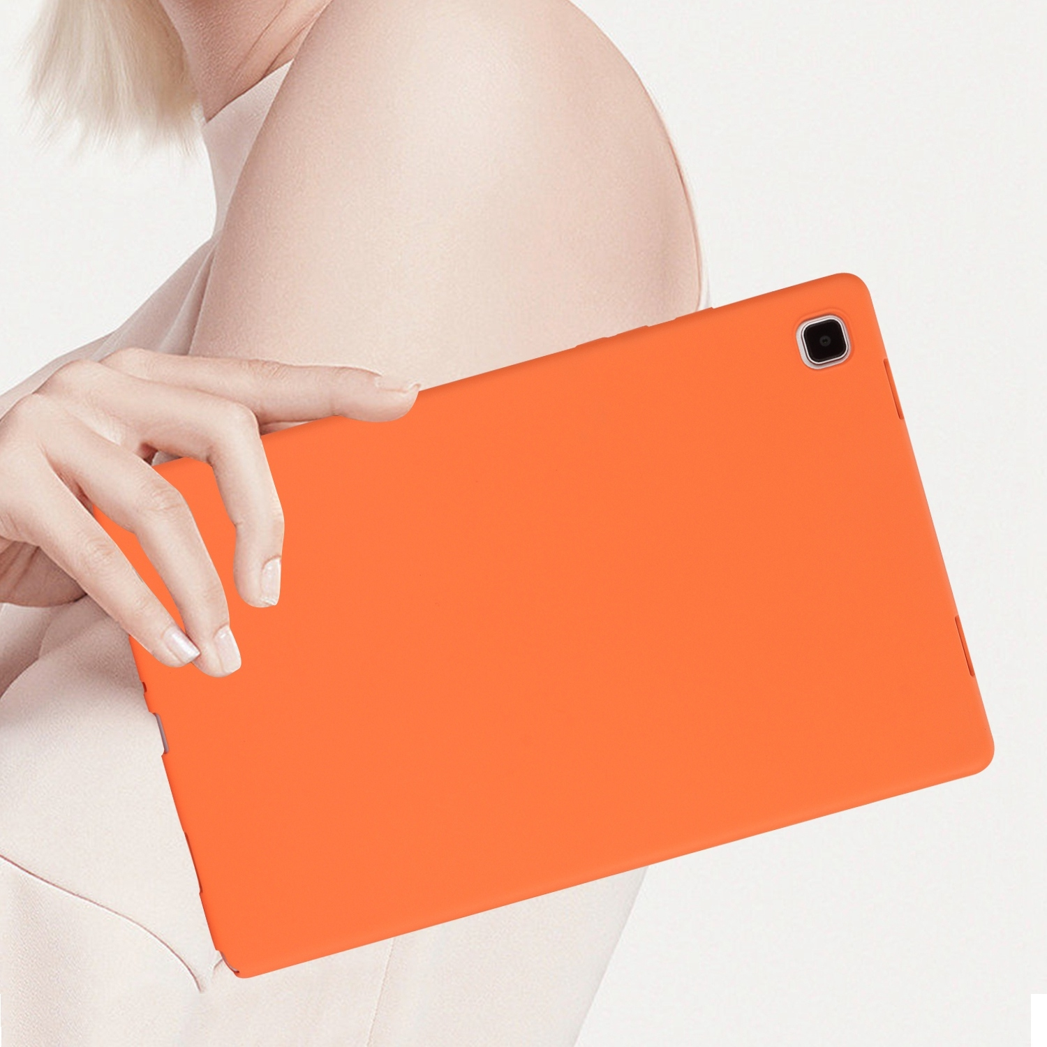 Oranges Tablet, das von einer Person gehalten wird. Weißer Hintergrund.