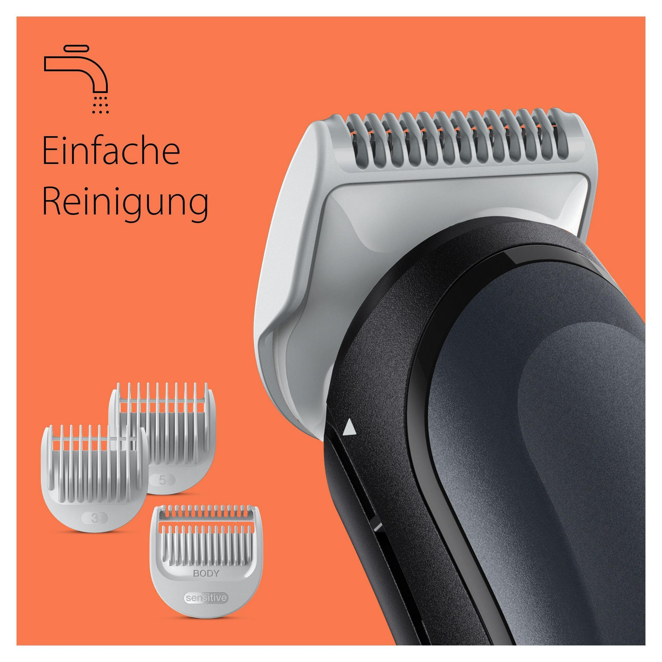 Nahaufnahme eines Trimmerkopfes mit drei Aufsatzkämmen, vor orangefarbenem Hintergrund.
